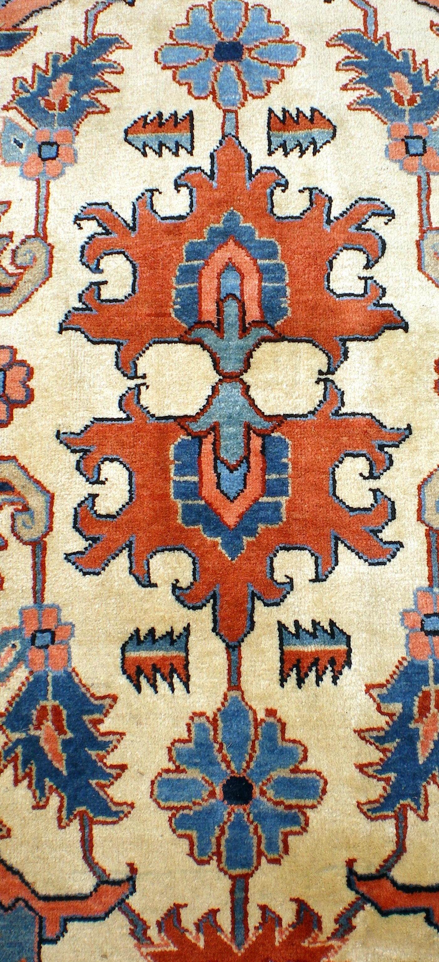 Persian Tabriz woven with very fine wool with geometric design.
Ivory background with navy boarder with touches of red. 