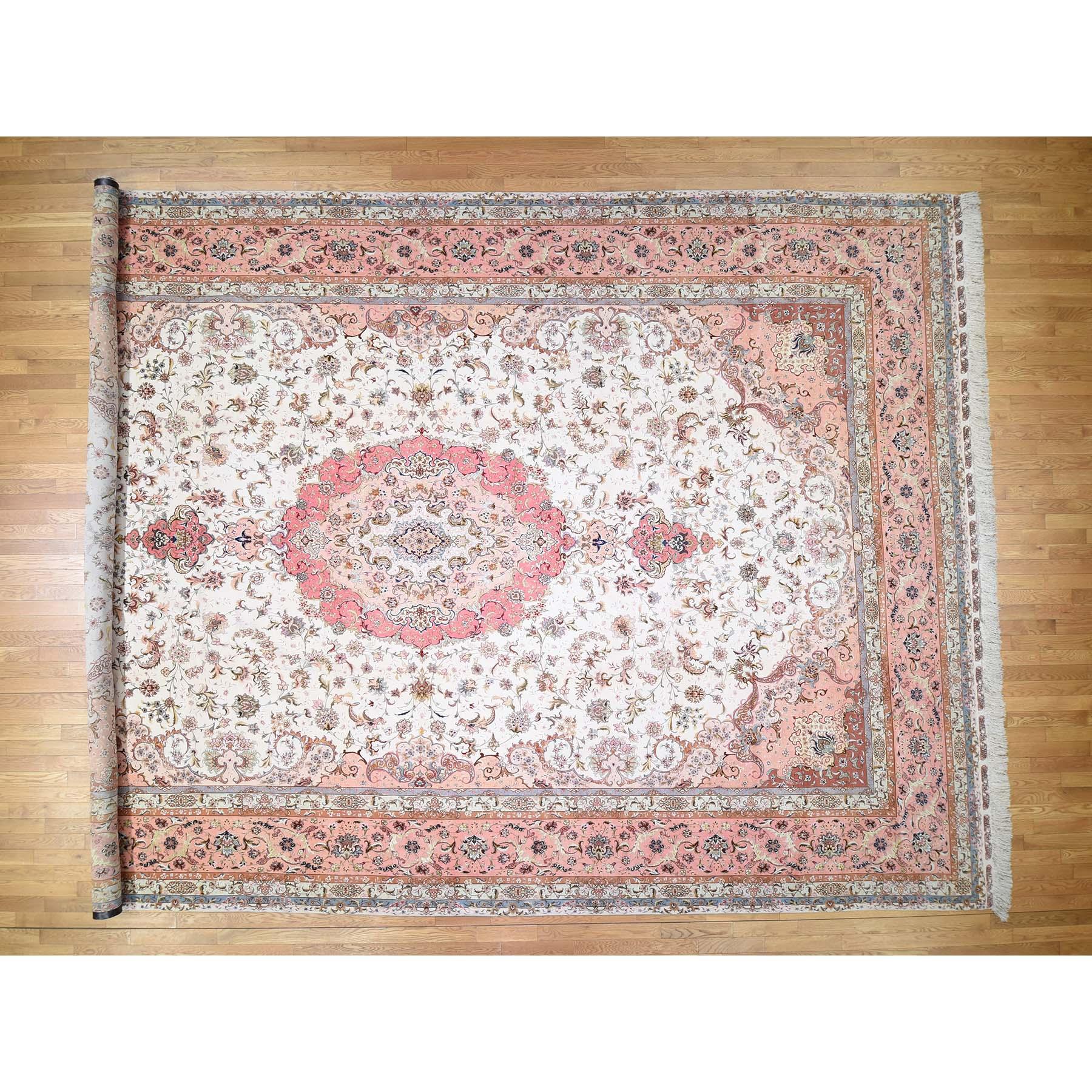 This is a truly genuine one-of-a-kind hand knotted Persian Tabriz 400 Kpsi mansion size wool and silk oriental rug. It has been knotted for months and months in the centuries-old Persian weaving craftsmanship techniques by expert artisans.
Primary