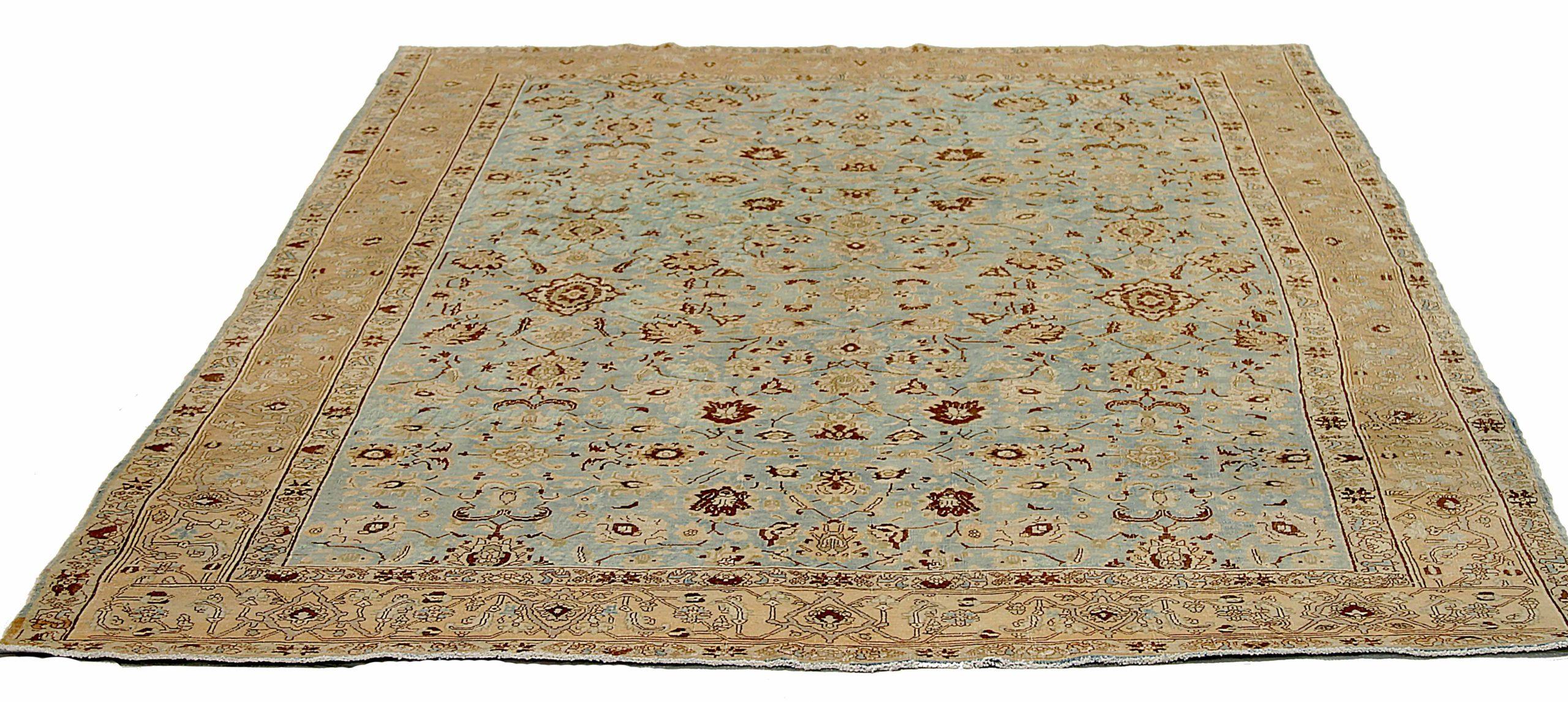 Scopri l'eleganza del Tabriz persiano con i tappeti d'area CIRCA del 1910. Progettato con lana e blu-marrone-giallo, questo design esclusivo è perfetto per valorizzare il tuo spazio.