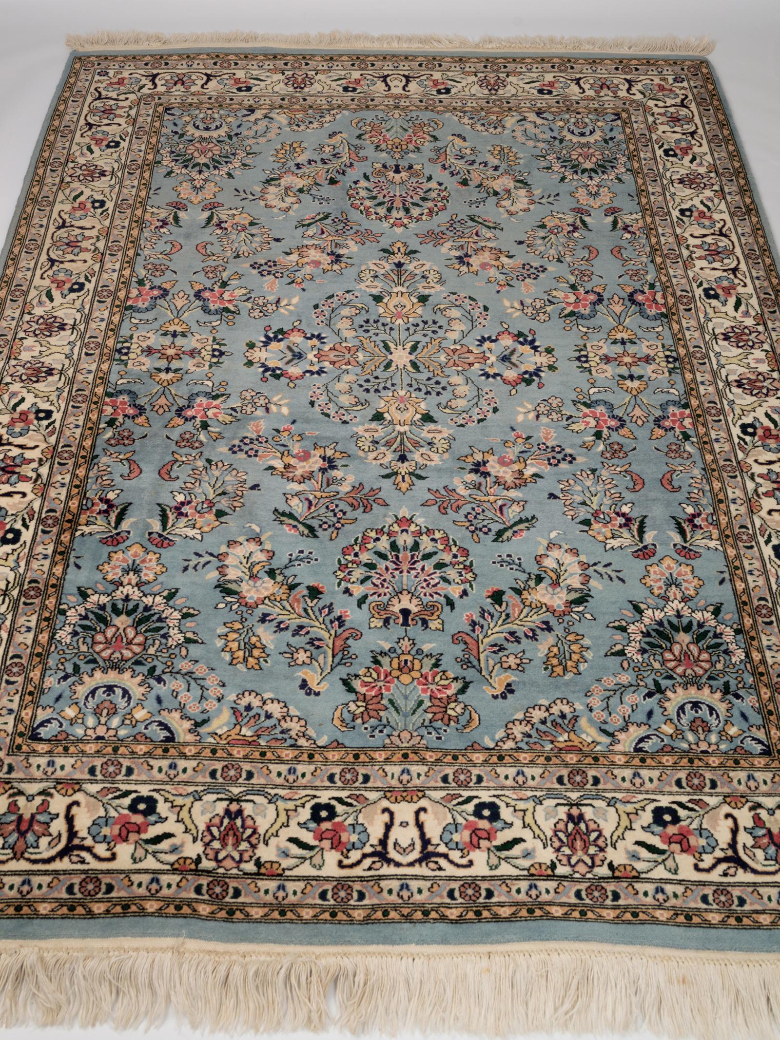 Persian Tabriz hand knotted floral blue and ivory rug, circa 1970.
100% wool pile on a cotton foundation.
Ground color is light blue with ivory detailing.
In excellent vintage condition commensurate of age. Beautifully preserved.