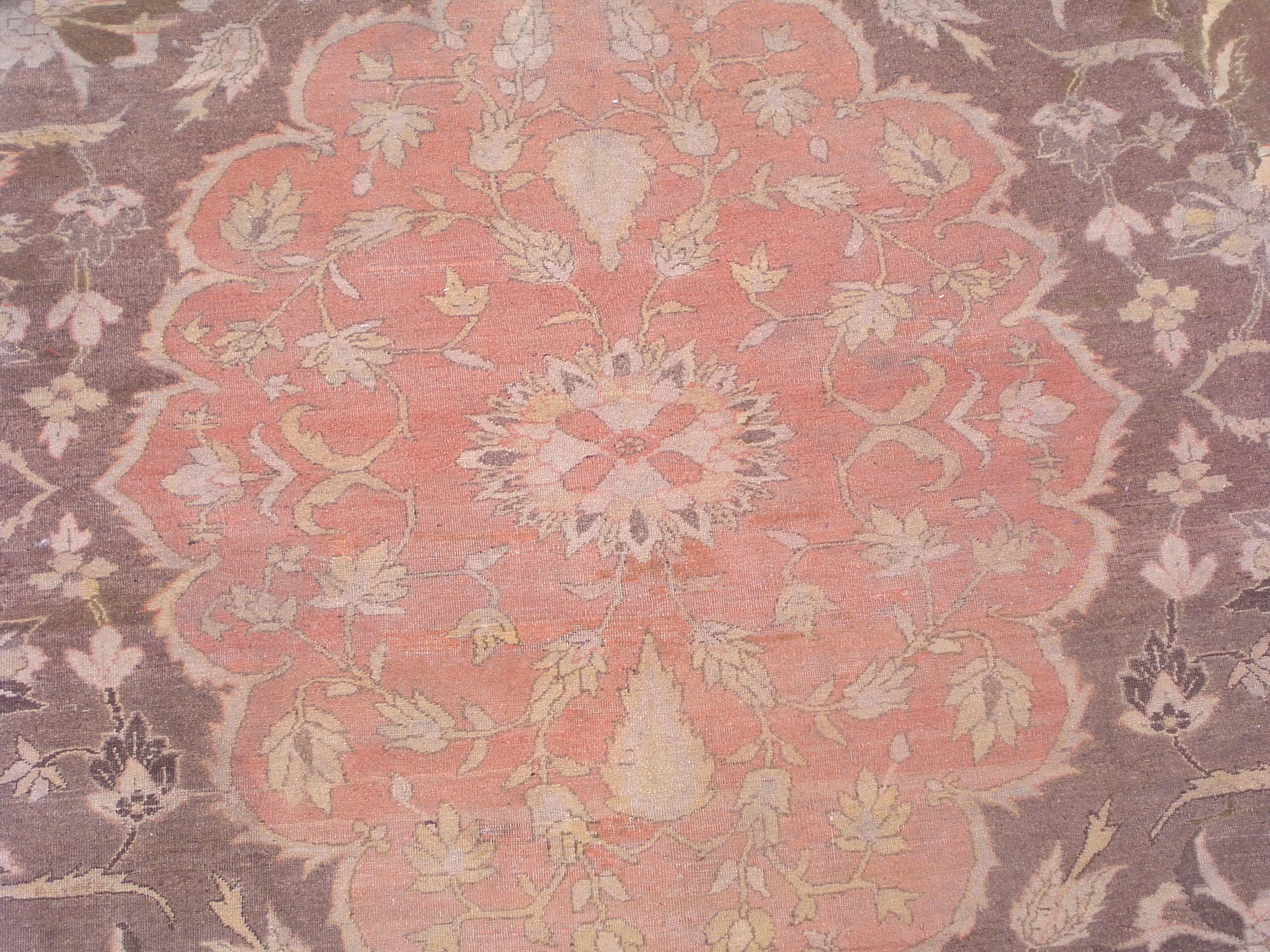 Persian Tabriz rug,

circa 1900.

Measures: 10' 11