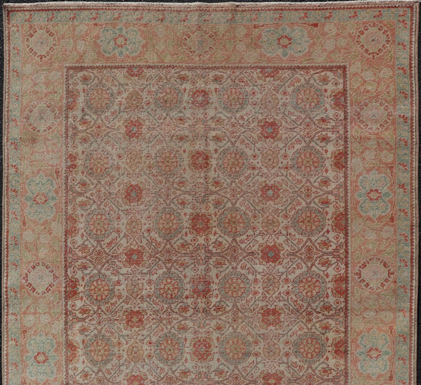 Antique Persian Tabriz rug with all-over floral design in light blue/ light green, salmon, coral, red-coral, and cream rug SUS-2012-697, country of origin / type: Iran / Tabriz, circa 1920

This antique Persian Tabriz carpet features a refined