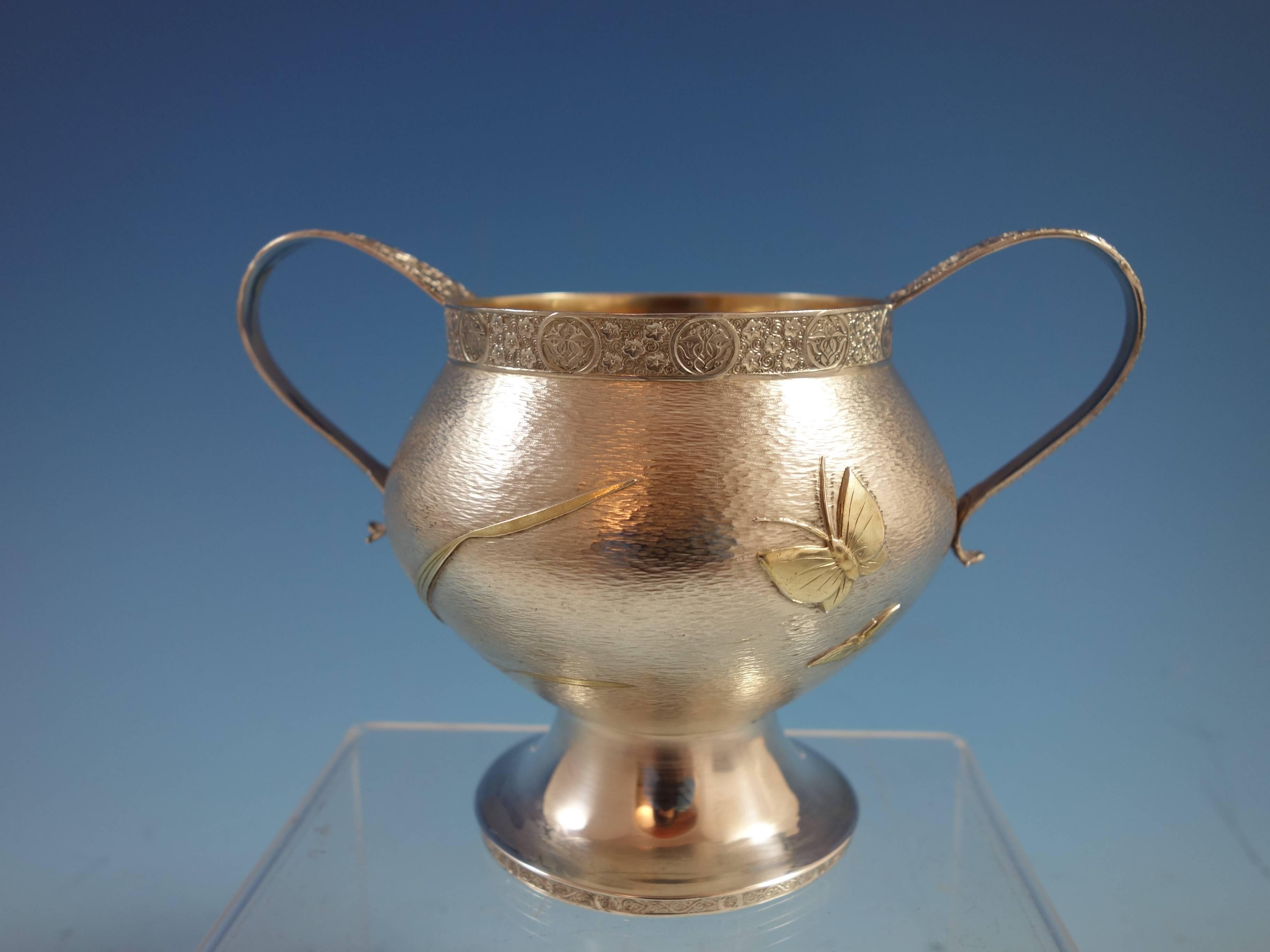 Exceptional Persian by Tiffany & Co. sterling silver sugar bowl. The piece has gorgeous applied gold grass/plants and gold butterflies. There are also partial gilt engraved details. The bowl is marked with #4494/M/8734