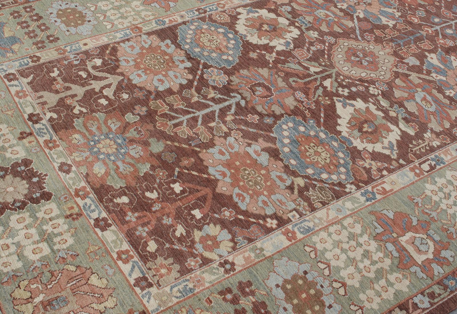 This Persian tribal hand-knotted rug is crafted with the finest hand carded, hand-spun wool, and is made with all natural dyes by the local Kurdish artisan weavers in Iran. Custom sizes and colors available. Rug size: 6'2