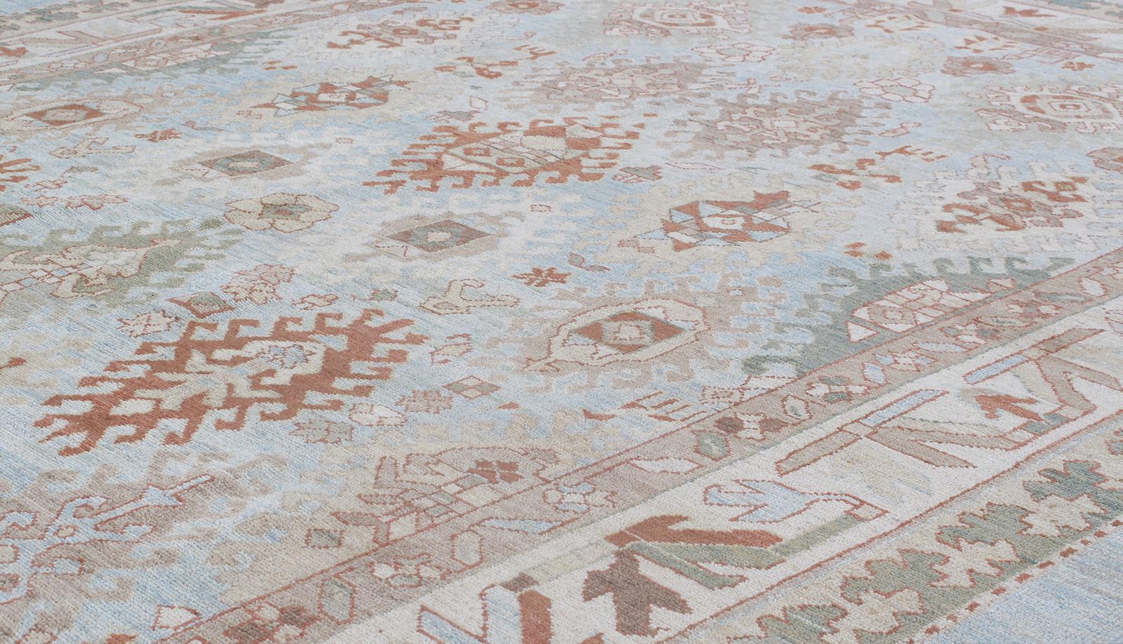 This Persian tribal hand-knotted rug is crafted with the finest hand-carded, hand-spun wool, and is made with all natural dyes. It resembles the antique original pieces designed by the Kurdish weavers in the northwestern part of Iran. Custom sizes