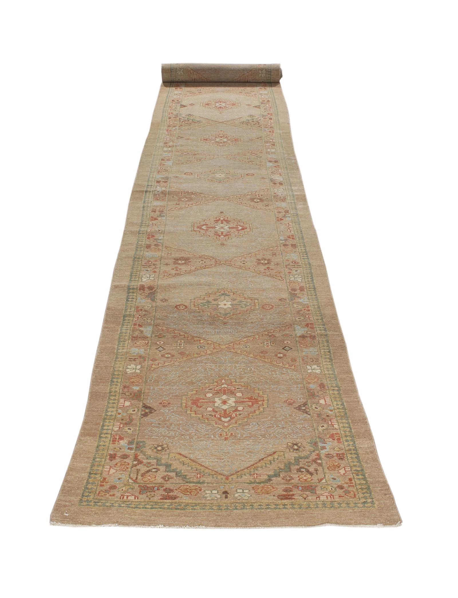 This Persian tribal hand-knotted runner rug is crafted with the finest hand-carded, hand-spun wool, and is made with all natural dyes. It resembles the antique original pieces designed by the Kurdish weavers in the northwestern part of Iran. Custom