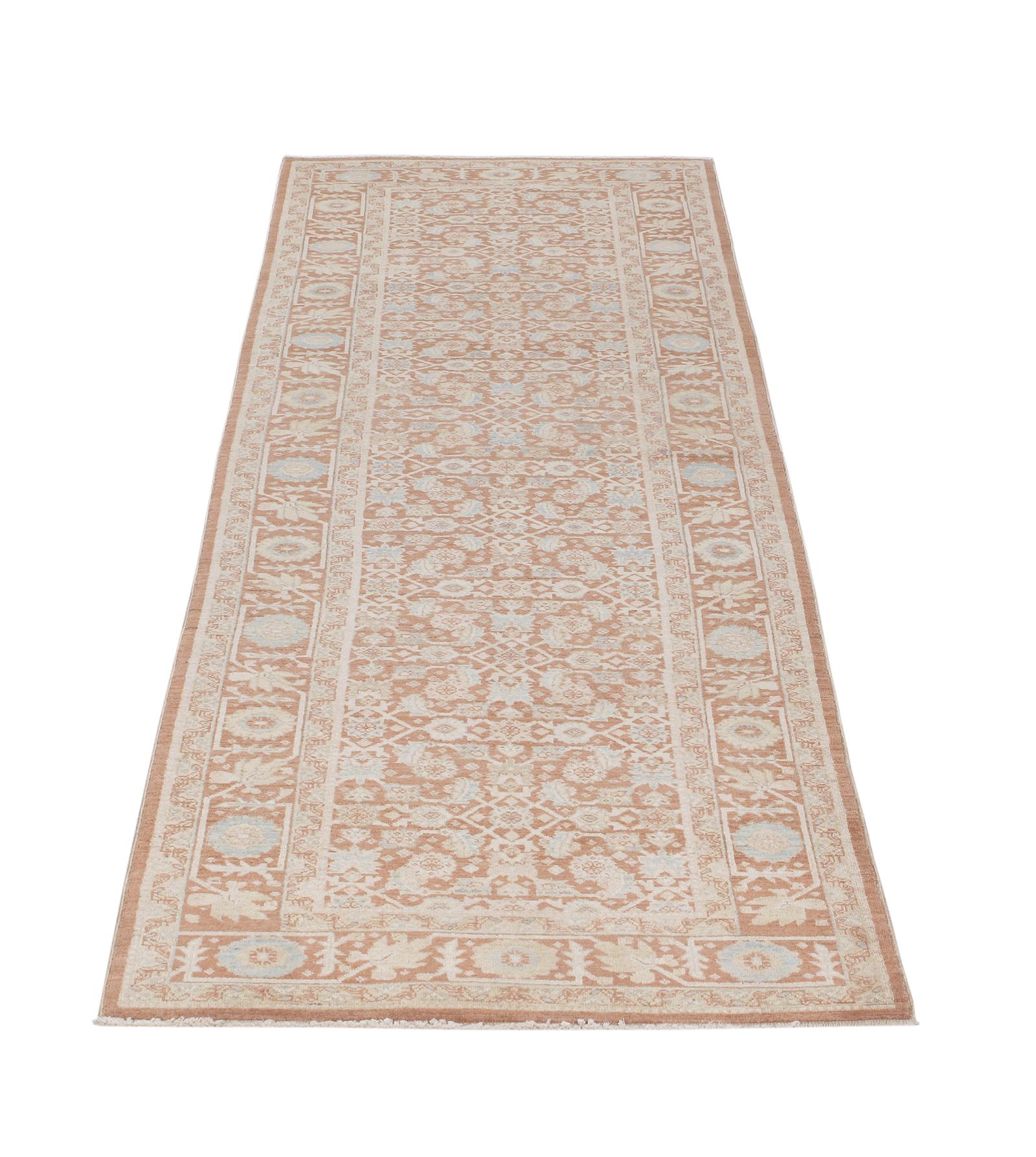 This Persian Tabriz hand-knotted runner rug is made with the finest hand-carded, hand-spun wool, and is distinguished by its excellent weave, and by the remarkable adherence to the classical traditions of Persian rug design. The city of Tabriz, in