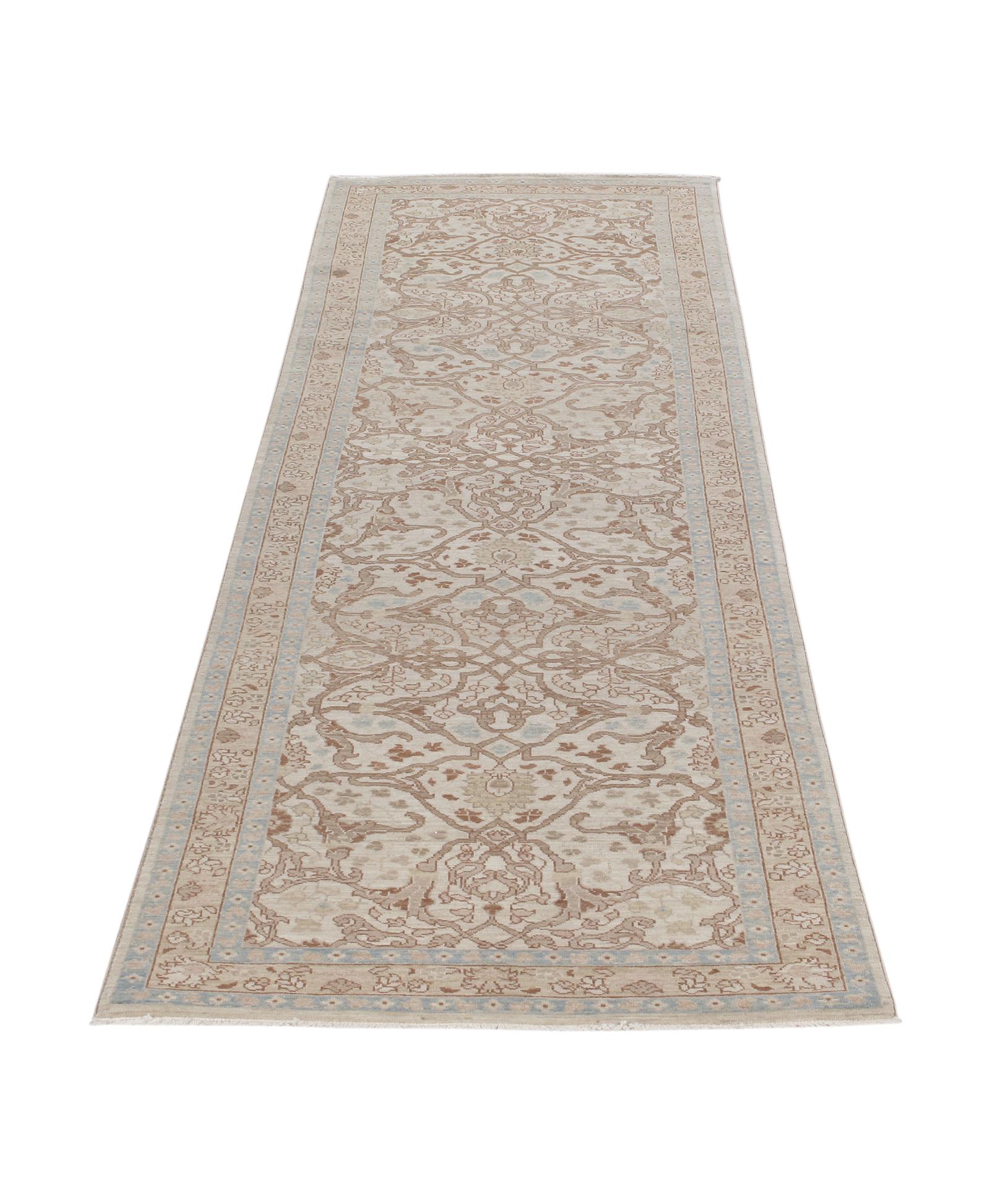 This Persian Tabriz hand-knotted runner rug is made from the finest hand-carded, hand-spun wool, and is distinguished by its excellent weave, and by the remarkable adherence to the classical traditions of Persian rug design. The city of Tabriz, in