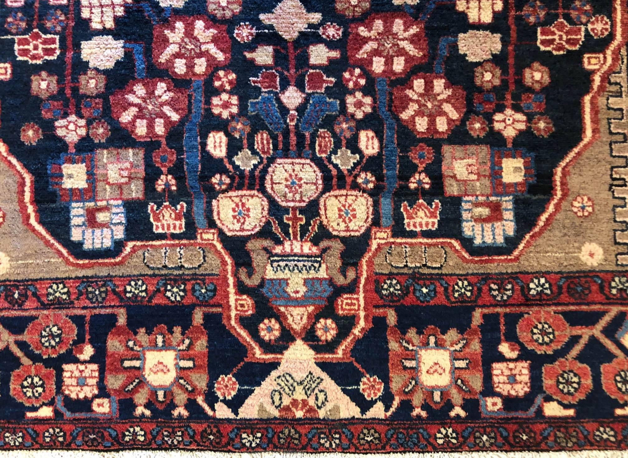 This piece is Persian Hamadan with wool pile and cotton foundation. Persian Hamadan rugs are easily recognized with their pattern and color combinations. The colors re dominated by different nuances of indigo blue, salmon or rose color. This rug is