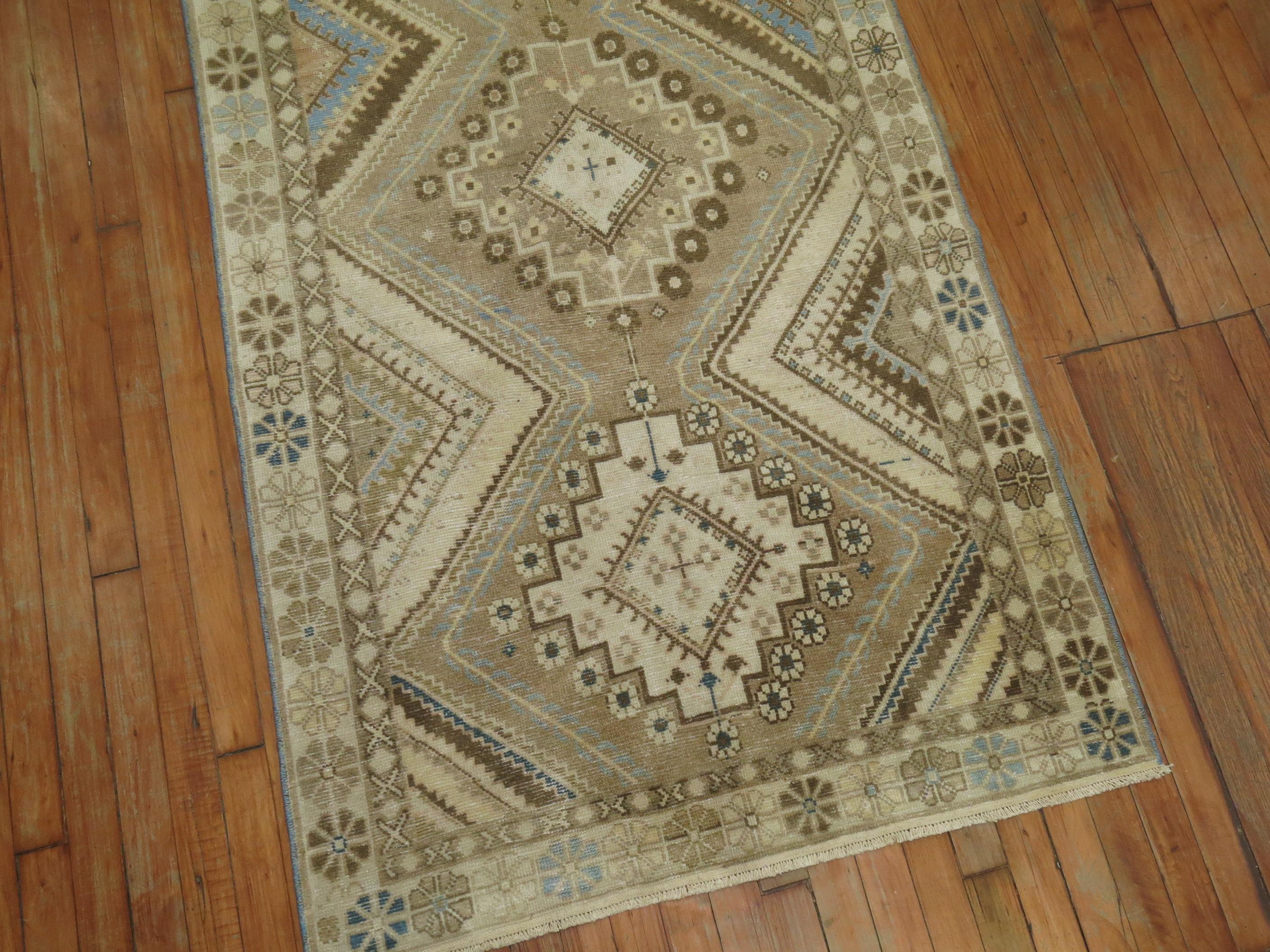 Tribal Persian runner in soft blues, clear white, browns and khaki color tones.

3'5'' x 10'2''