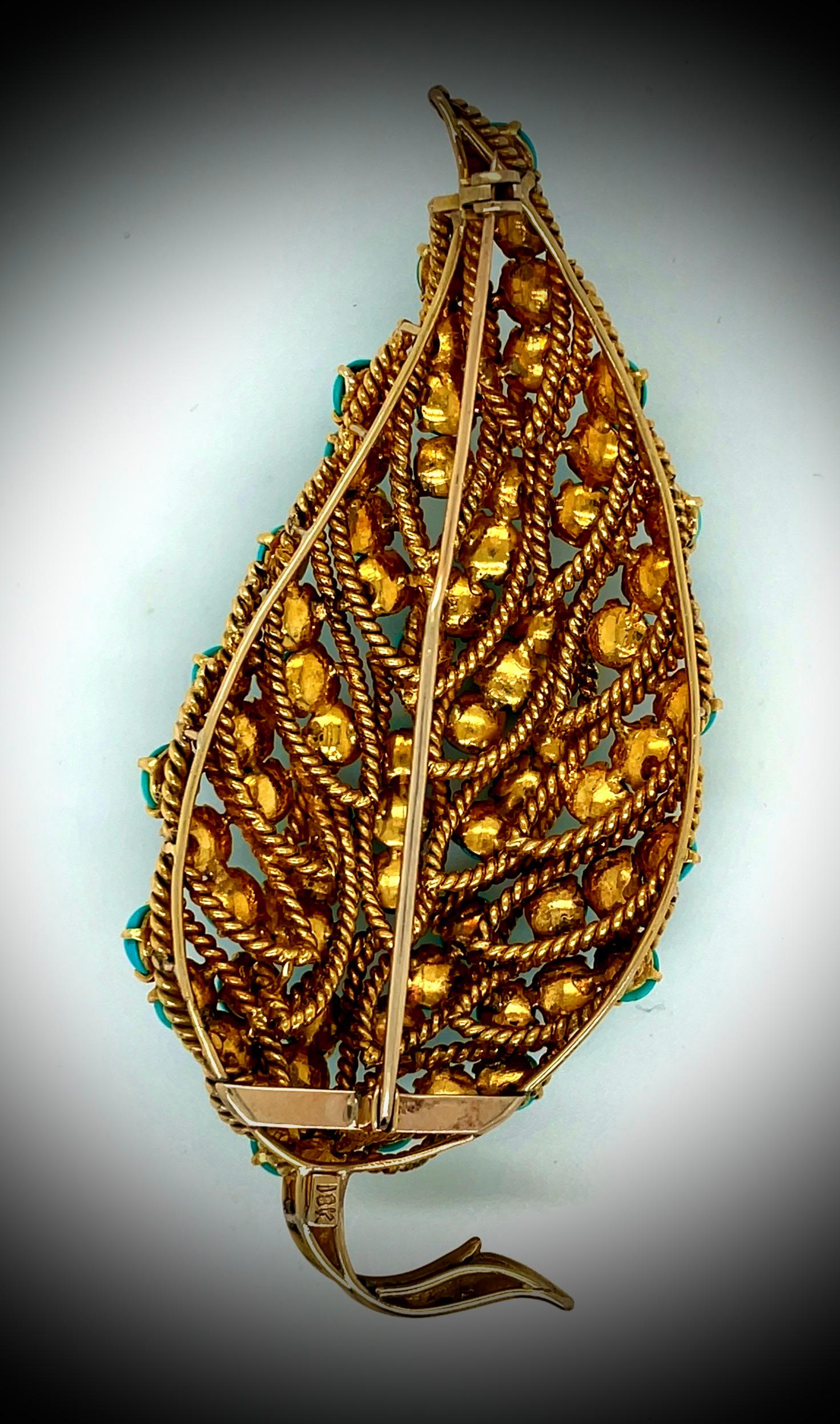 This stunning leaf shaped brooch is very unique and gorgeous. Featuring vivid round shaped Persian turquoise stones, all set in 32 grams of 18k yellow gold. This brooch is three inches long and 1 1/2 inches wide. This brooch is the perfect addition