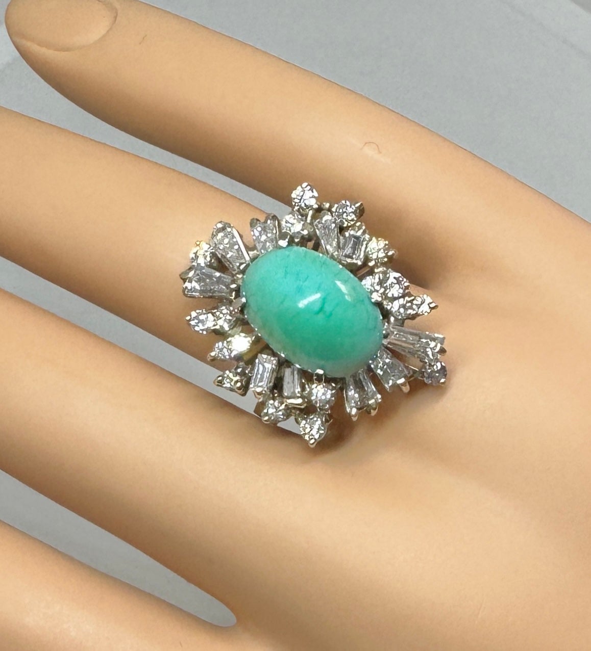 Indulge in a gorgeous Antique Retro Persian Turquoise and 2.5 Carat Diamond Ring.  The combination of Persian Turquoise and sparkling white Diamonds is the combination everyone dreams of.  The sparkling halo design of the ring highlights the blue
