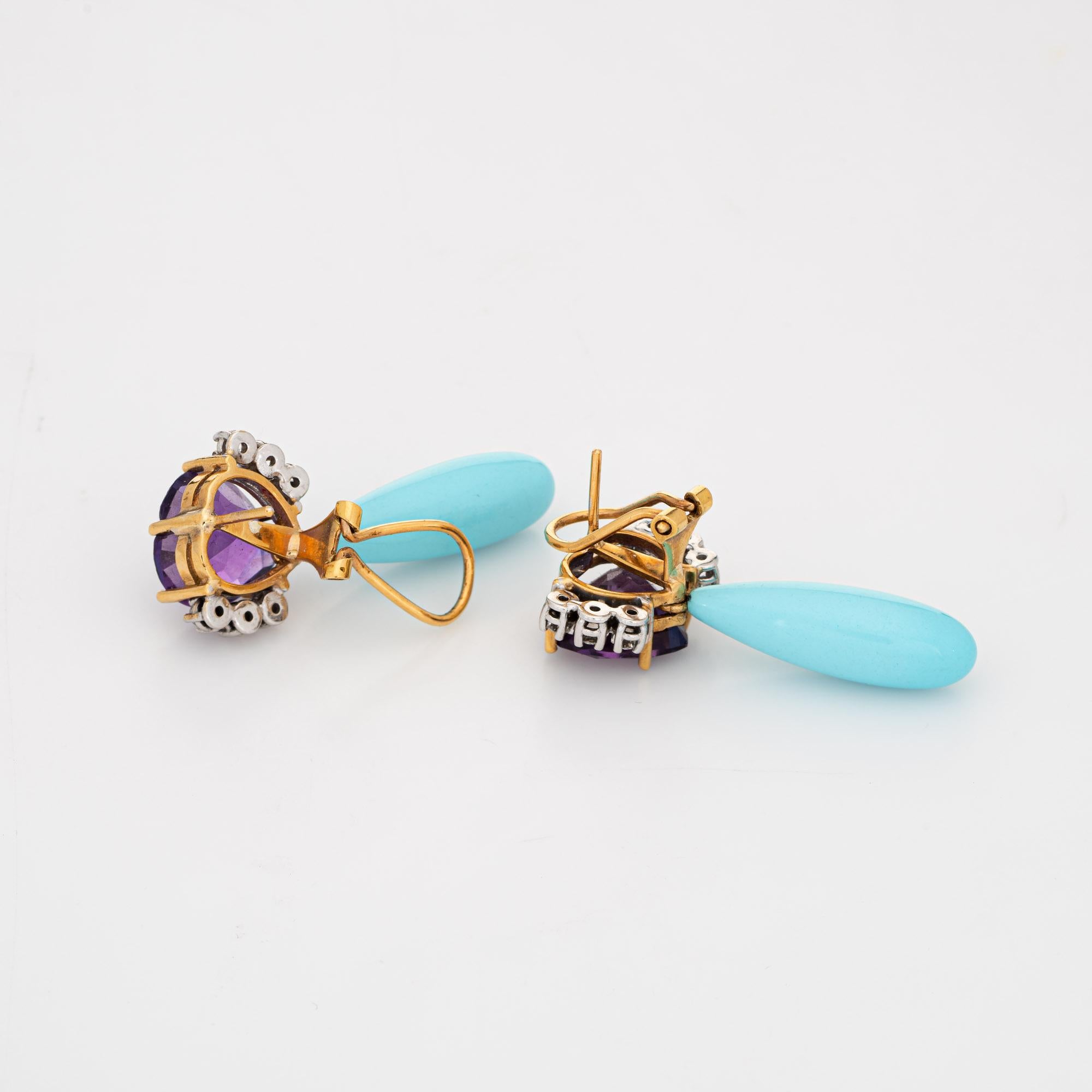 Striking and elegant pair of vintage Persian turquoise, amethyst & diamond pendant drop earrings (circa 1960s to 1970s) crafted in 18k yellow gold. 

Persian turquoise measures 25mm x 8mm, accented with two estimated 5 carat heart cut amethysts (10