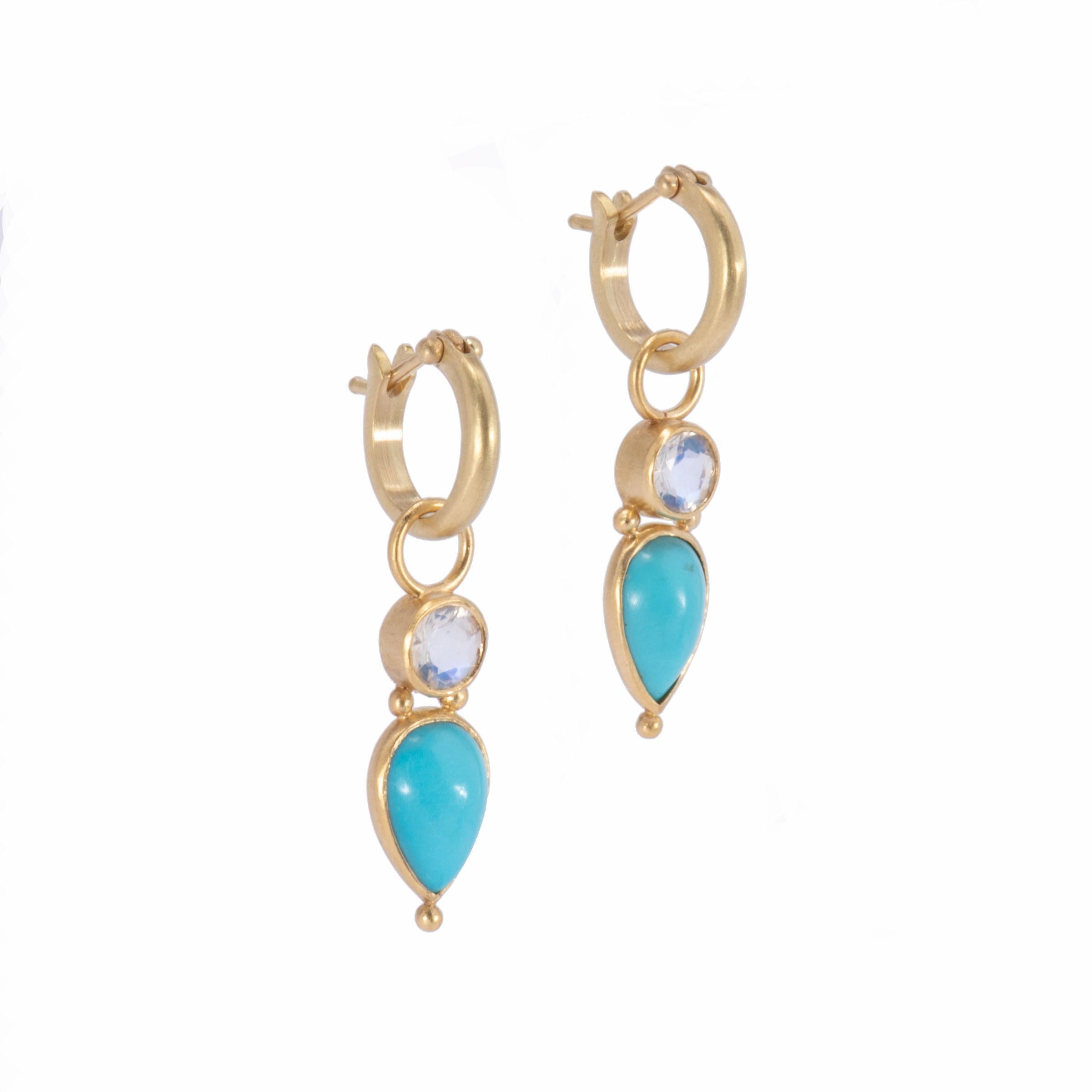 Lush tear drop cabochons of clear sky blue Persian Turquoise sit below faceted round moonstones set in 18k gold. Bezel set with our signature satin finish, these Persian Turquoise & Moonstone Drop Earrings hang from small plain hoops in 18k gold