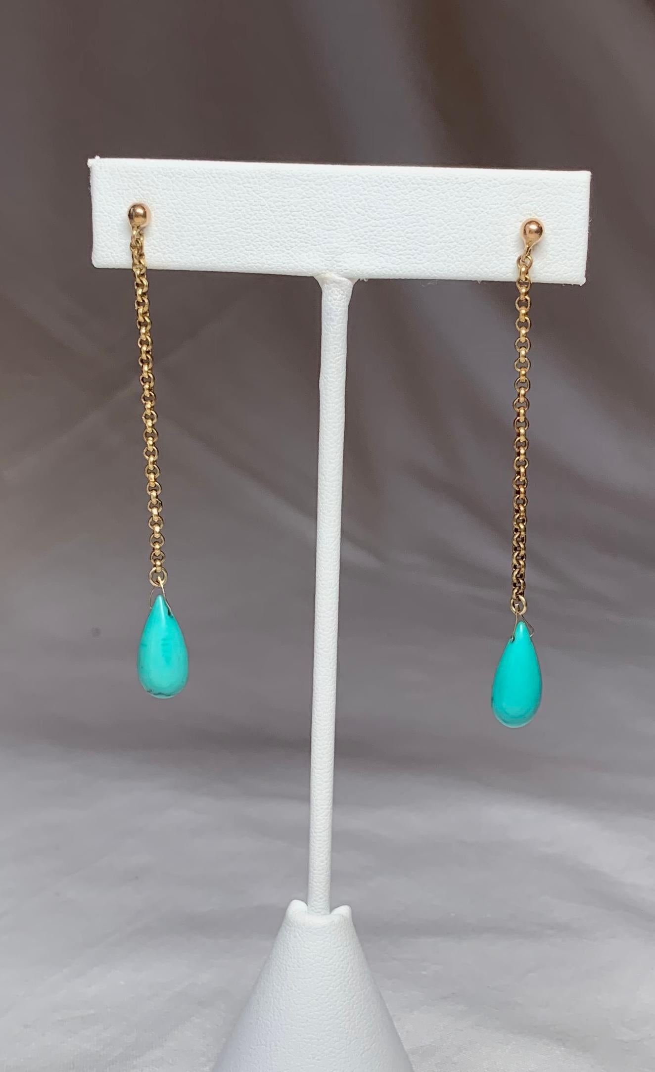 A STUNNING PAIR OF ESTATE EARRINGS WITH GORGEOUS PEAR SHAPED PERSIAN TURQUOISE GEMS IN A DRAMATIC LENGTH OF 2.75 INCHES.  THE TURQUOISE IS AN INCREDIBLE COLOR.  THE GOLD IS 9K ROSE GOLD.  A WONDERFUL FUN ROMANTIC PAIR.
The earrings are in excellent