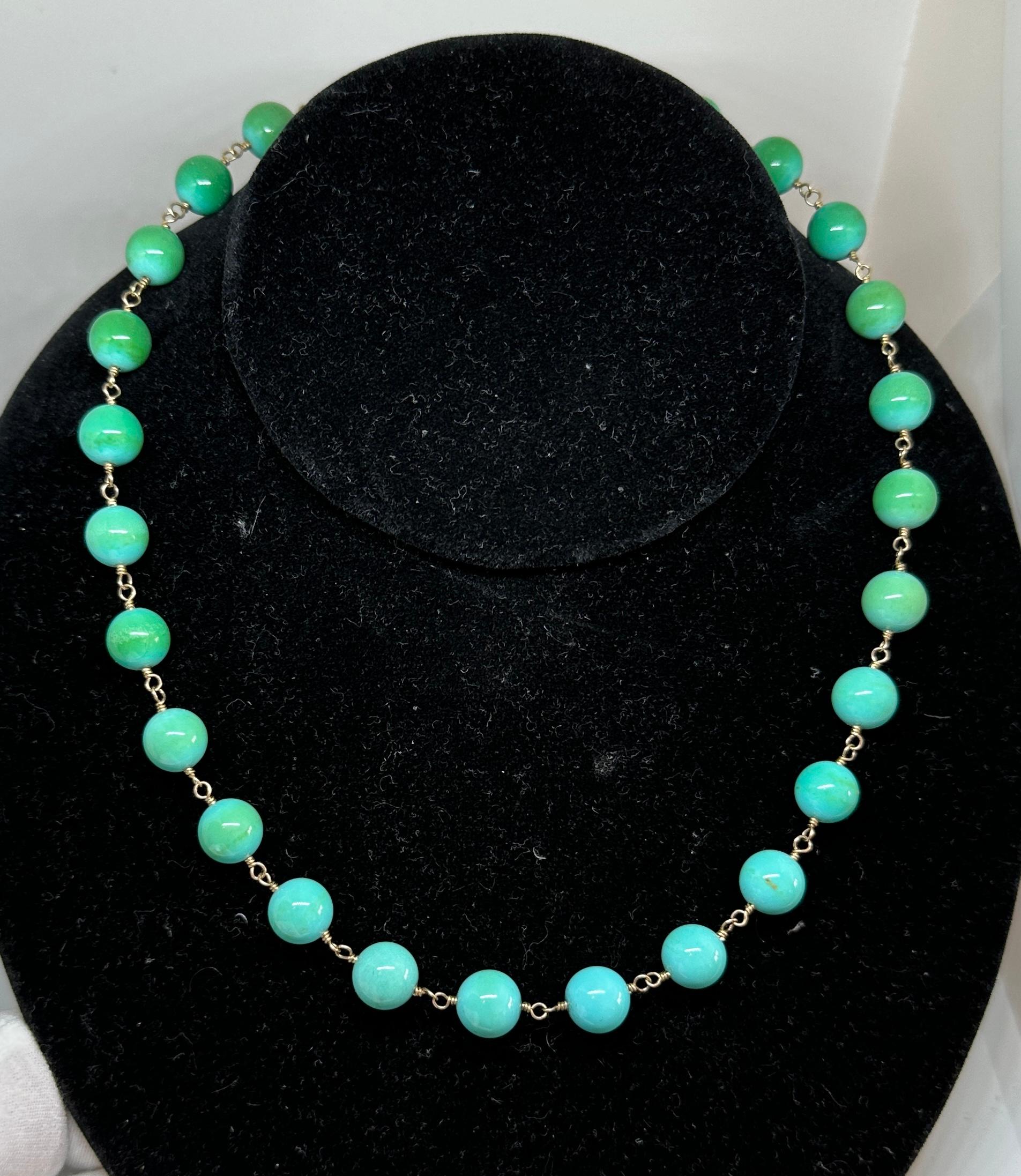 This is a beautiful Persian Turquoise 14 Karat Yellow Gold Necklace.  The lovely necklace has 10mm natural Persian Turquoise beads interspaced with 14 Karat Yellow Gold links and a 14 Karat Yellow Gold hook clasp.  The elegant Persian turquoise has