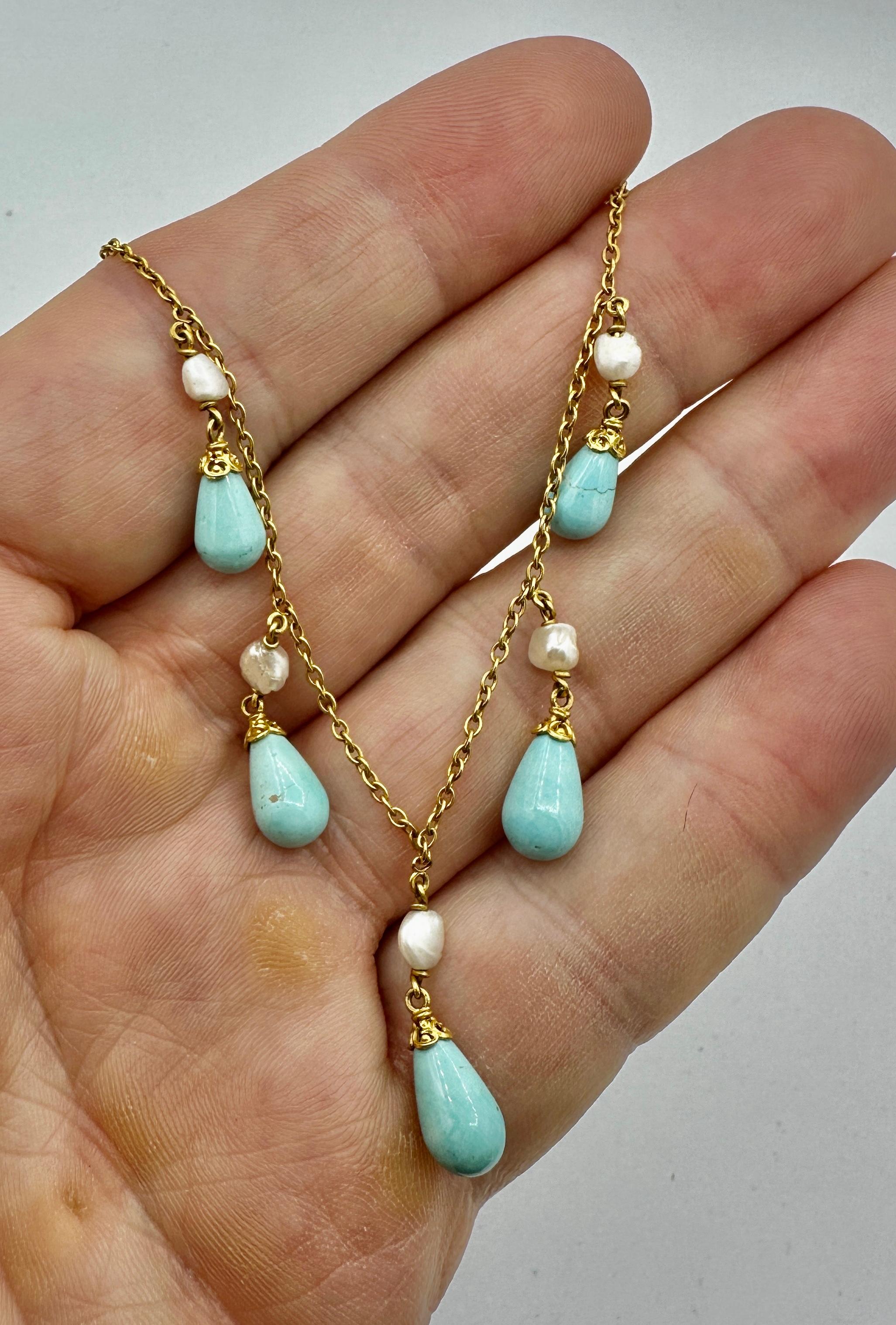 THIS IS A STUNNING PERSIAN TURQUOISE ANTIQUE VICTORIAN - BELLE EPOQUE NECKLACE WITH THE MOST GORGEOUS NATURAL PEAR SHAPE   TEARDROP TURQUOISE GEMS SET IN A WONDERFUL PENDANT FRINGE DESIGN ADORNED WITH PEARLS IN 14 KARAT GOLD.
This antique Persian
