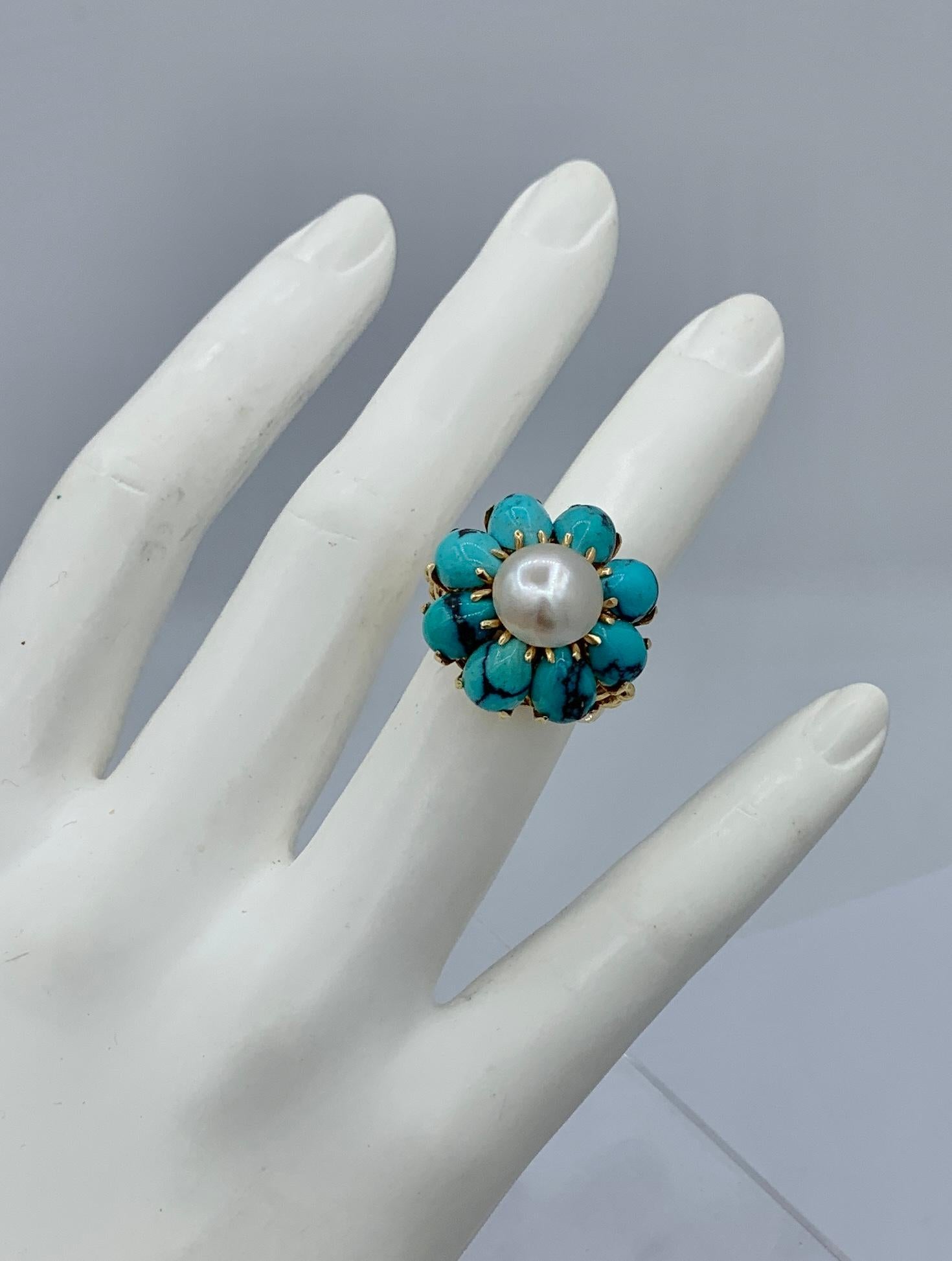 This is a gorgeous Antique Retro - Art Deco Ring with beautiful natural Persian Turquoise cabochons of stunning beauty with a central magnificent white Pearl and set in 14 Karat Yellow Gold.   The eight Persian Turquoise gems are beautiful large