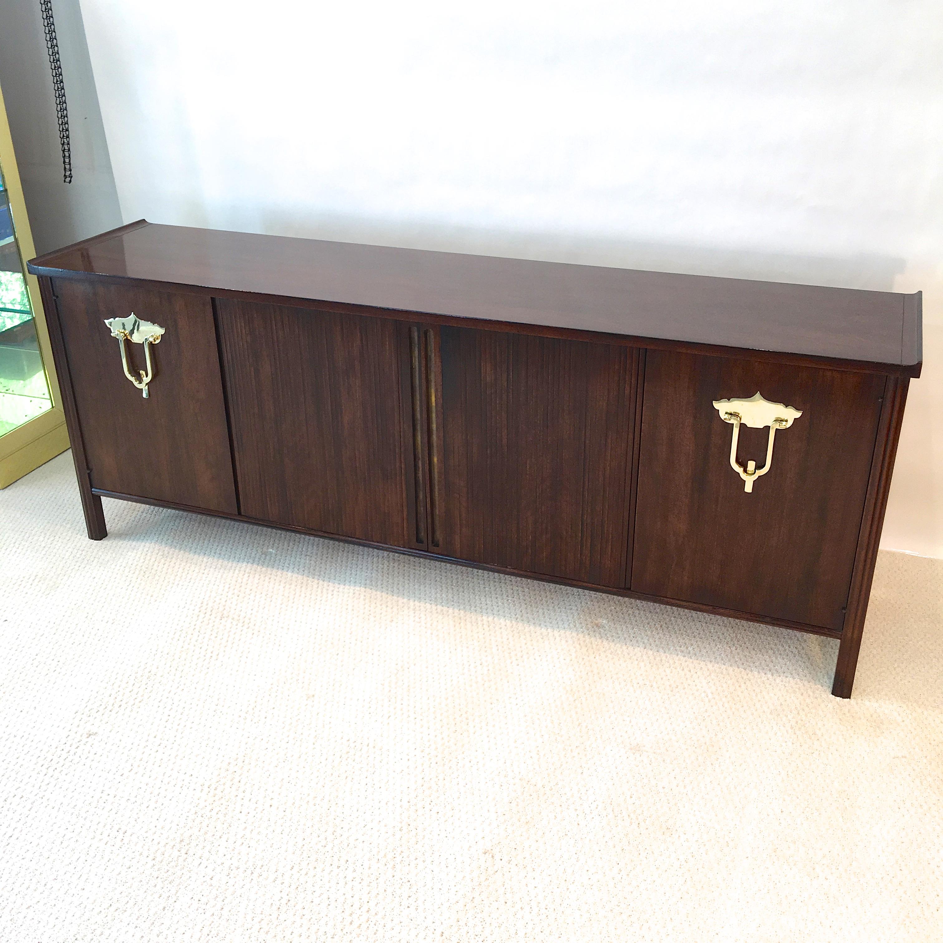 Luxurious nine drawer dresser in Persian walnut designed by Bert England for the John Widdicomb's Orientation Group. End doors with chunky solid brass 