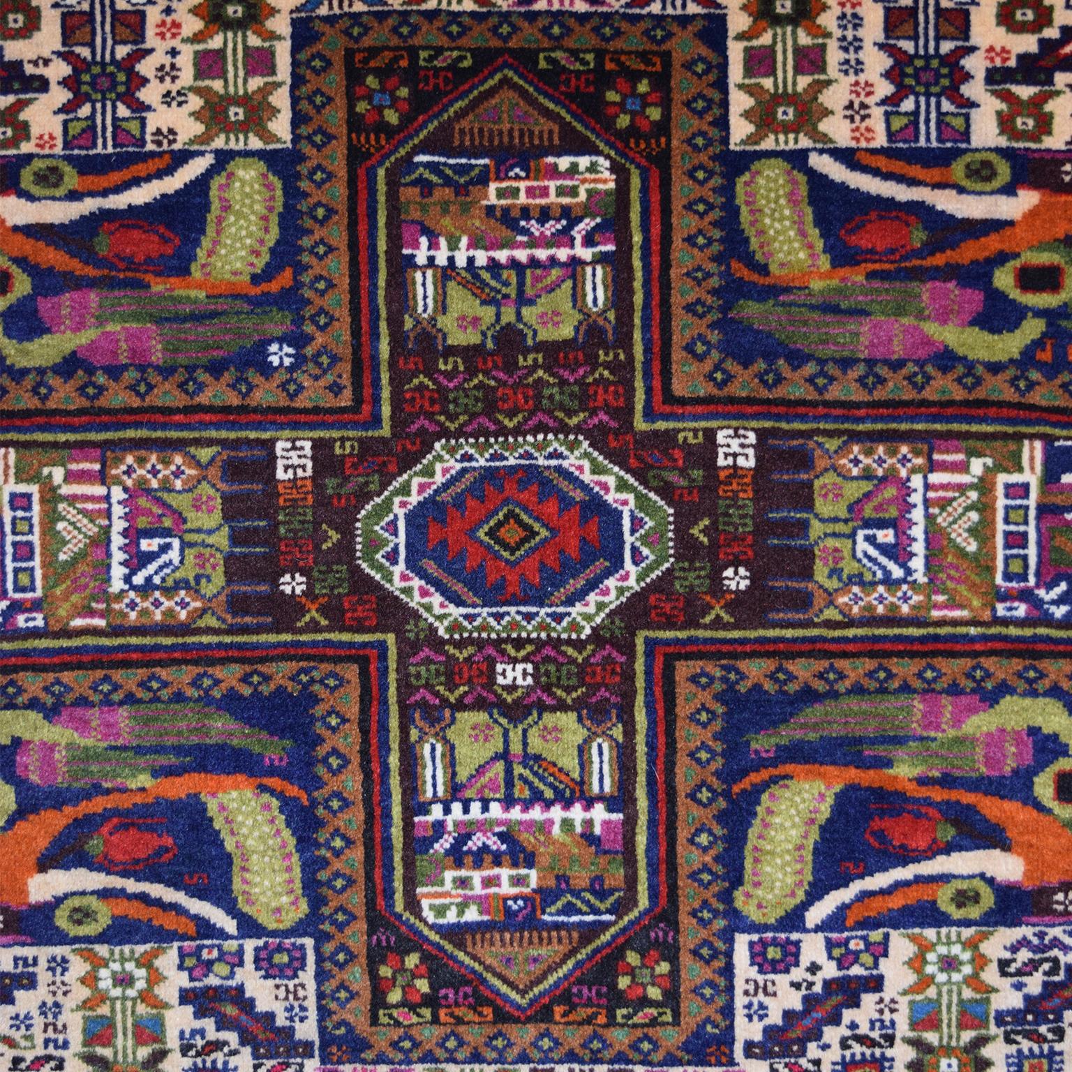 This Persian Zabol carpet circa 1940 in handspun wool and vegetal dyes was created in Zabol in the province of Sistan. This carpet features an overall garden design, with three sets of four intersecting lines dividing the main field. Following