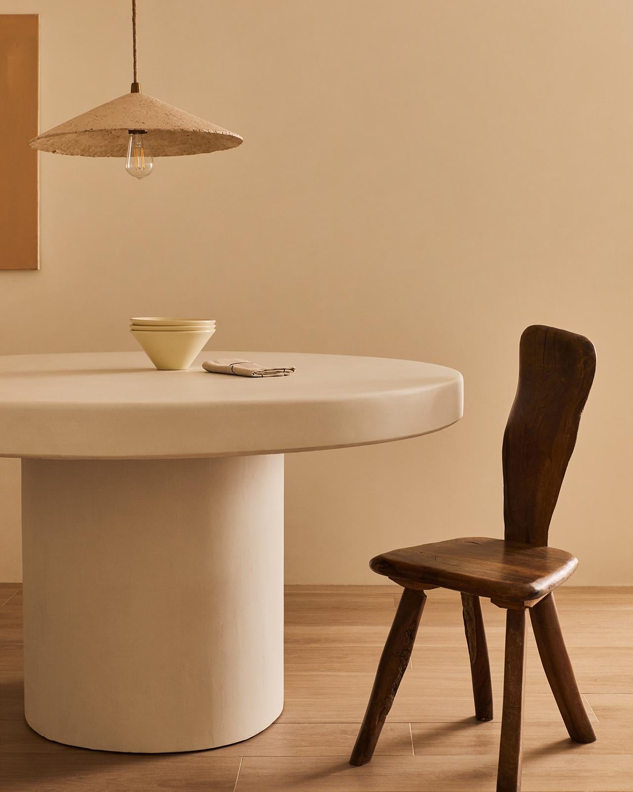 Handcrafted in Spain by expert artisans, this oval-shaped dining table from Marlot Baus combines timeless design with modern craftsmanship. Each piece is carefully made using our signature microcement technique, layered by hand to achieve a smooth,
