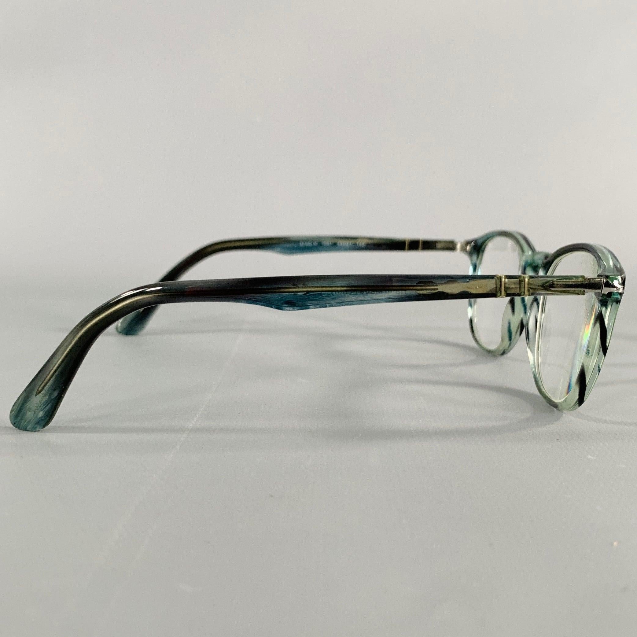 PERSOL eyeglasses frames
in a blue and grey acetate featuring a marbled design, and silver tone metal temple accents. Comes with case. Handmade in Italy. Note: these frames contain corrective lenses, which will need to be changed by an optician