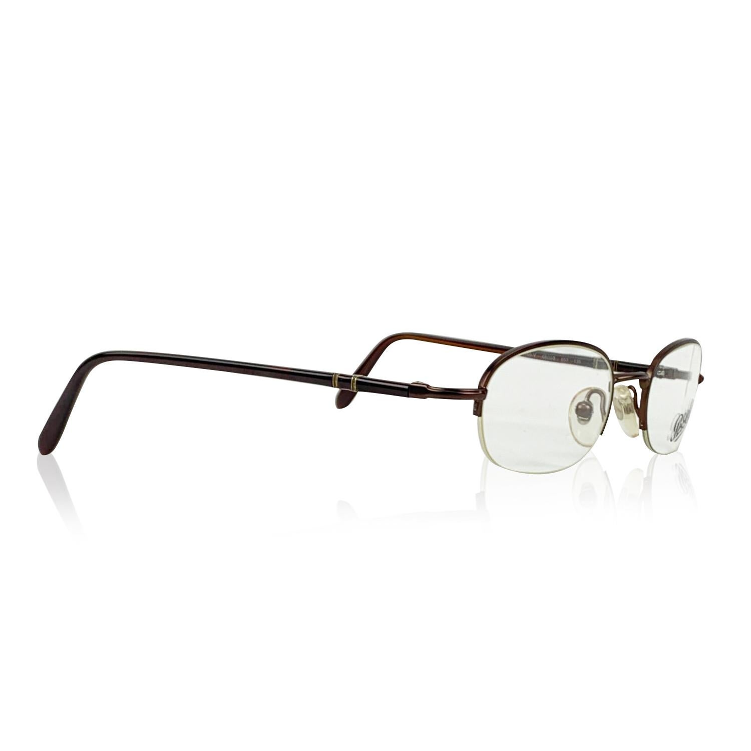 PERSOL Vintage Eyeglasses- Model: 2065V. Half Rim design- Brown metal frame. Clear demo lenses. Meflecto System on arms (2 metal pins which are inserted vertically into the ear stems and provide flexibility in the stems). Made in Italy. Style &