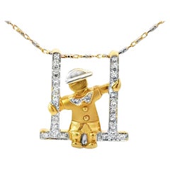 Collier personne en balançoire diamant 2 tons or blanc et jaune 14k