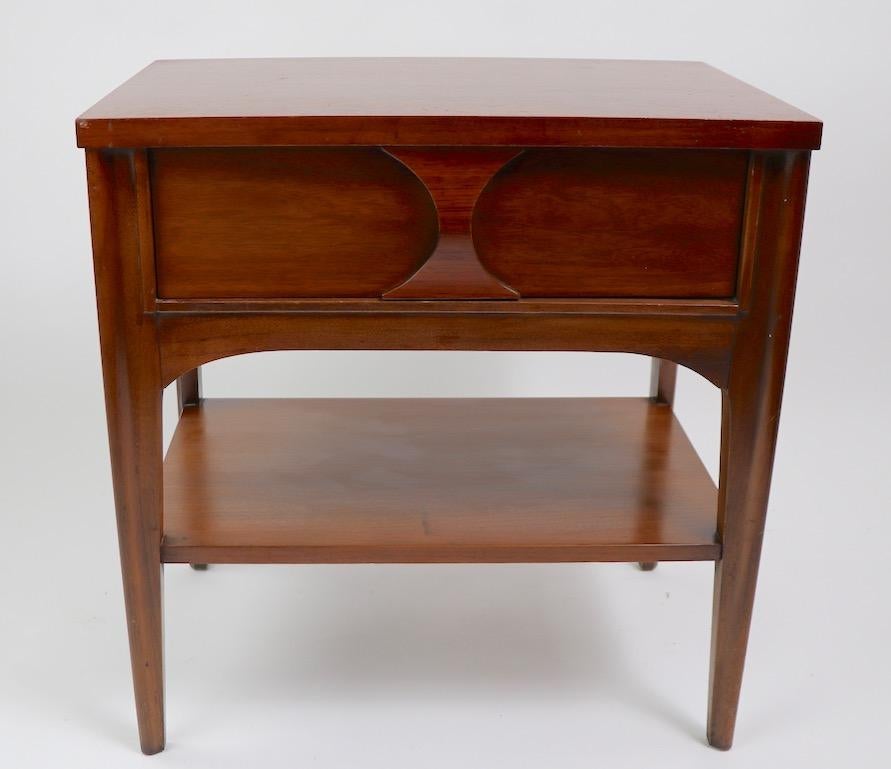 Perspecta line nightstand designed by Kent Coffey. Executed in walnut, elm and rosewood, lower shelf 9 inch H. Originally designed as a night table, this can also double as an end or side table. This example is in good, original condition, showing