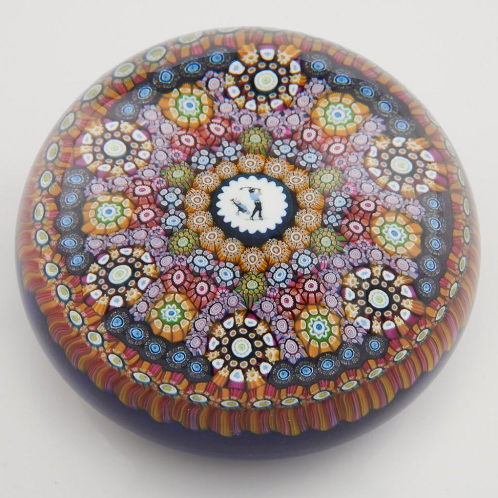 Heading : A Perthshire PP81 Millefiori Golfer Paperweight 1992
Date : 1992
Origin : Scotland
Features : Complex millefiori golfer cane centrally surrounded by concentric rings of canes and six complex cane roundels to the outer rim
Marks : A P1992