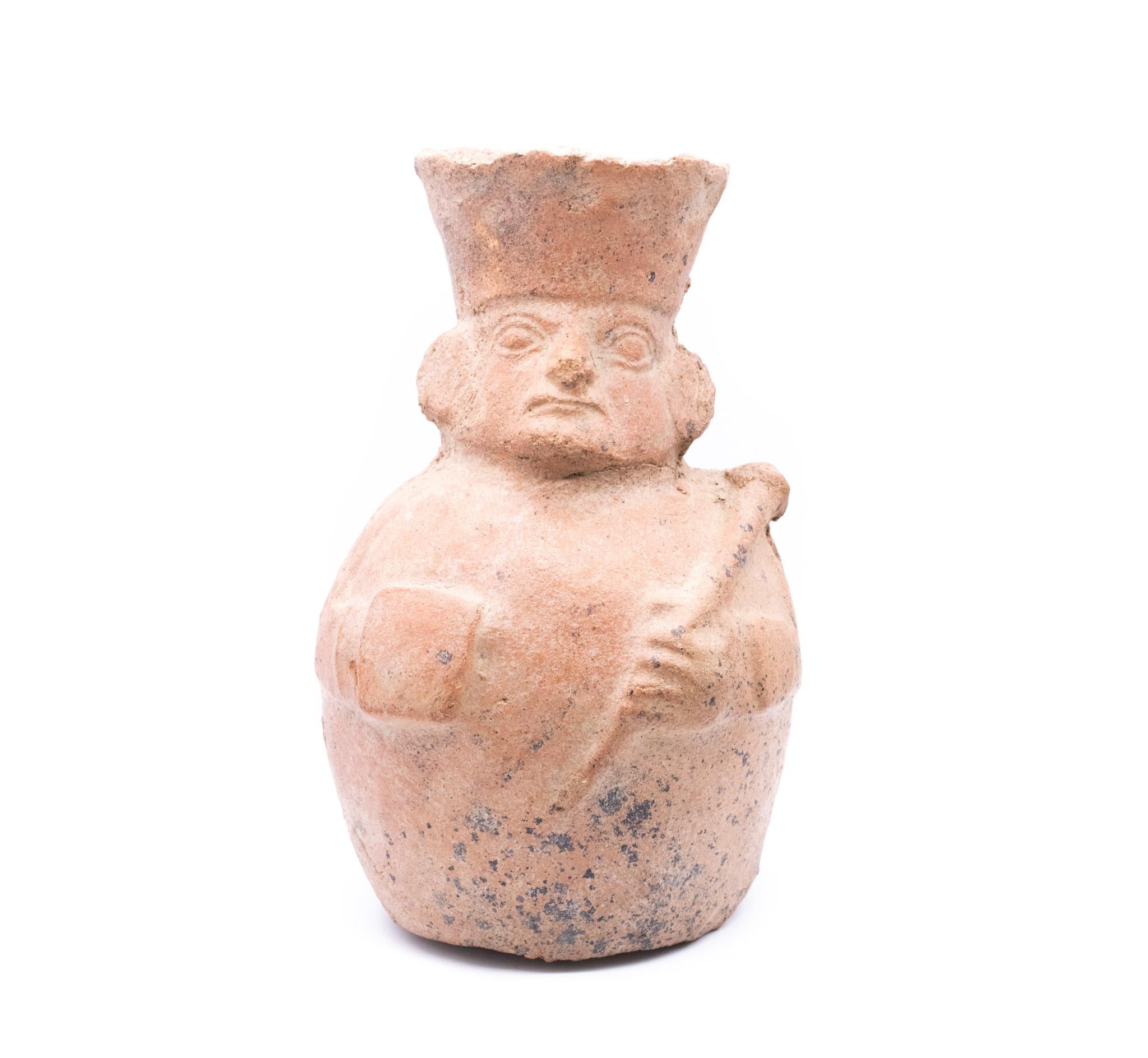 Rare pre Hispanic Moche culture, pre-Inca earthenware vessel.

A beautiful interesting piece, created in the southern Peru region around the 100-700 AD by the Moche culture. This rare early period face-neck vessel has been crafted from red earth