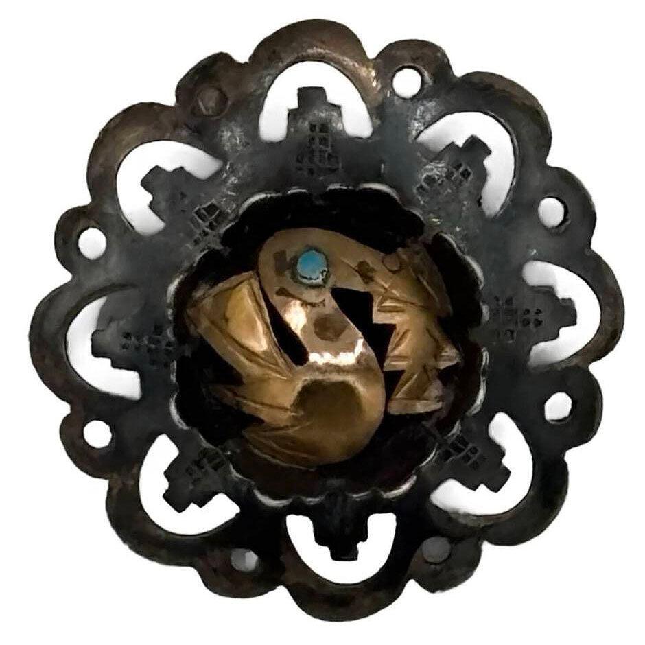 Peruvian geometric design 18k gold and sterling silver bird openwork broch that exudes elegance with its finely detailed design. The bird's delicate form is accented by a vivid turquoise eye, adding a pop of color and charm to the piece. Dual