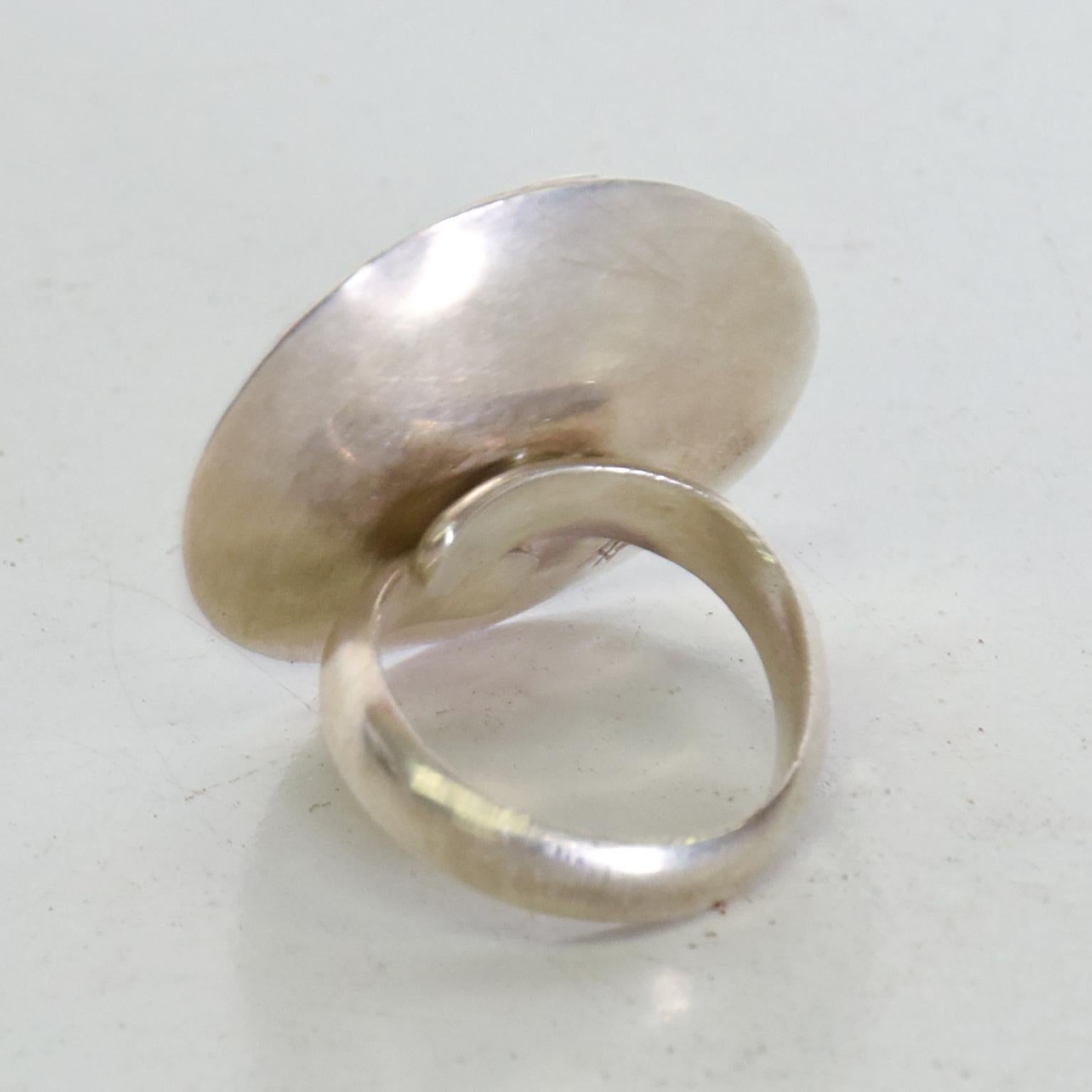 For your consideration, a Peruvian Modern Ring .950 Mid Century Modern. Signed with maker information on the back. Dimensions: 1 1/8
