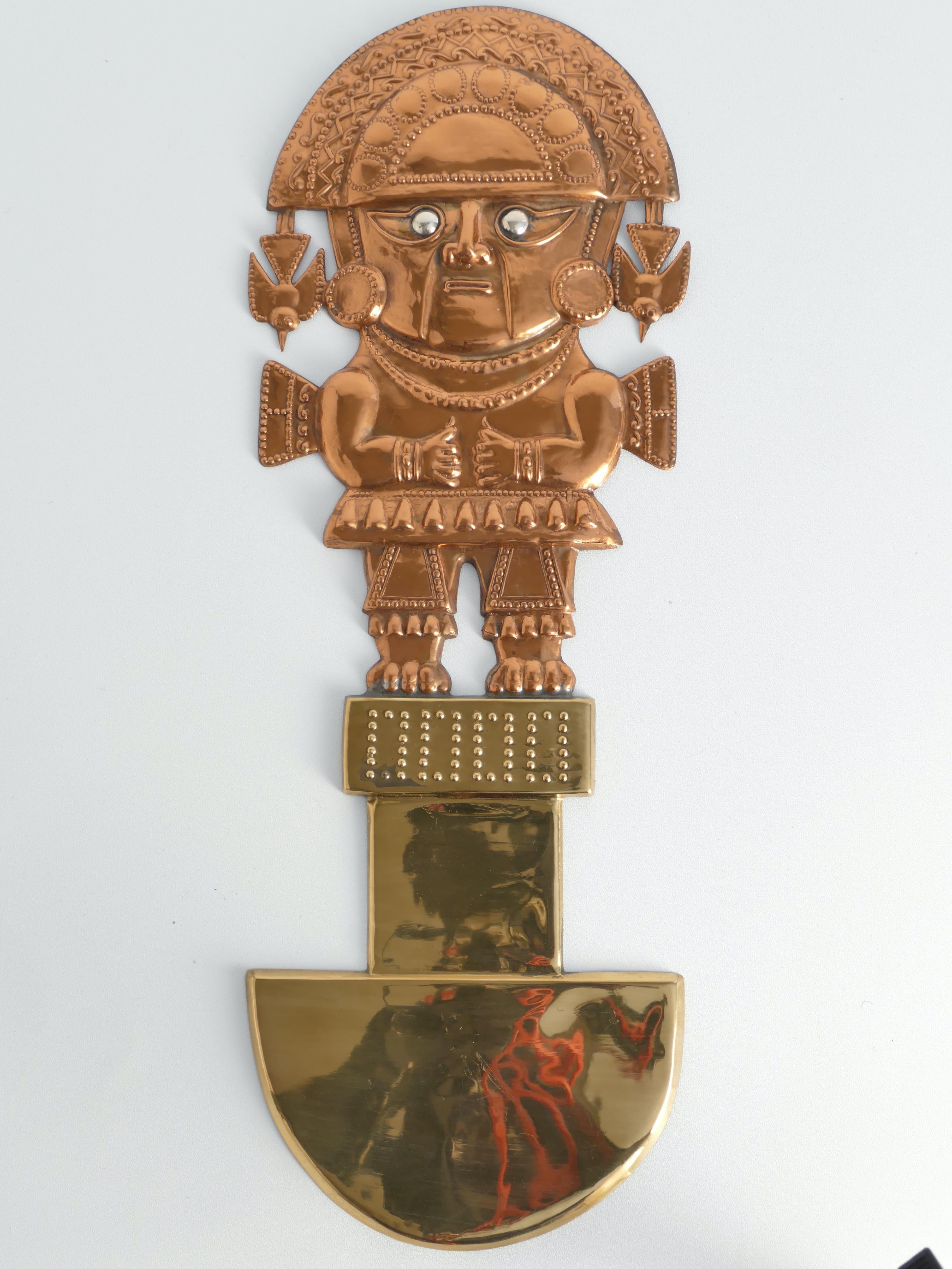 A brass and copper model of a Tumi or ceremonial knife, with an adorable motif of Naylamp, the founder of the ancient Peruvian Sican culture.

ABOUT TUMIS, NAYLAMP AND THE SICAN CULTURE
In Inca mythology, the Tumis played a crucial role in the Inti
