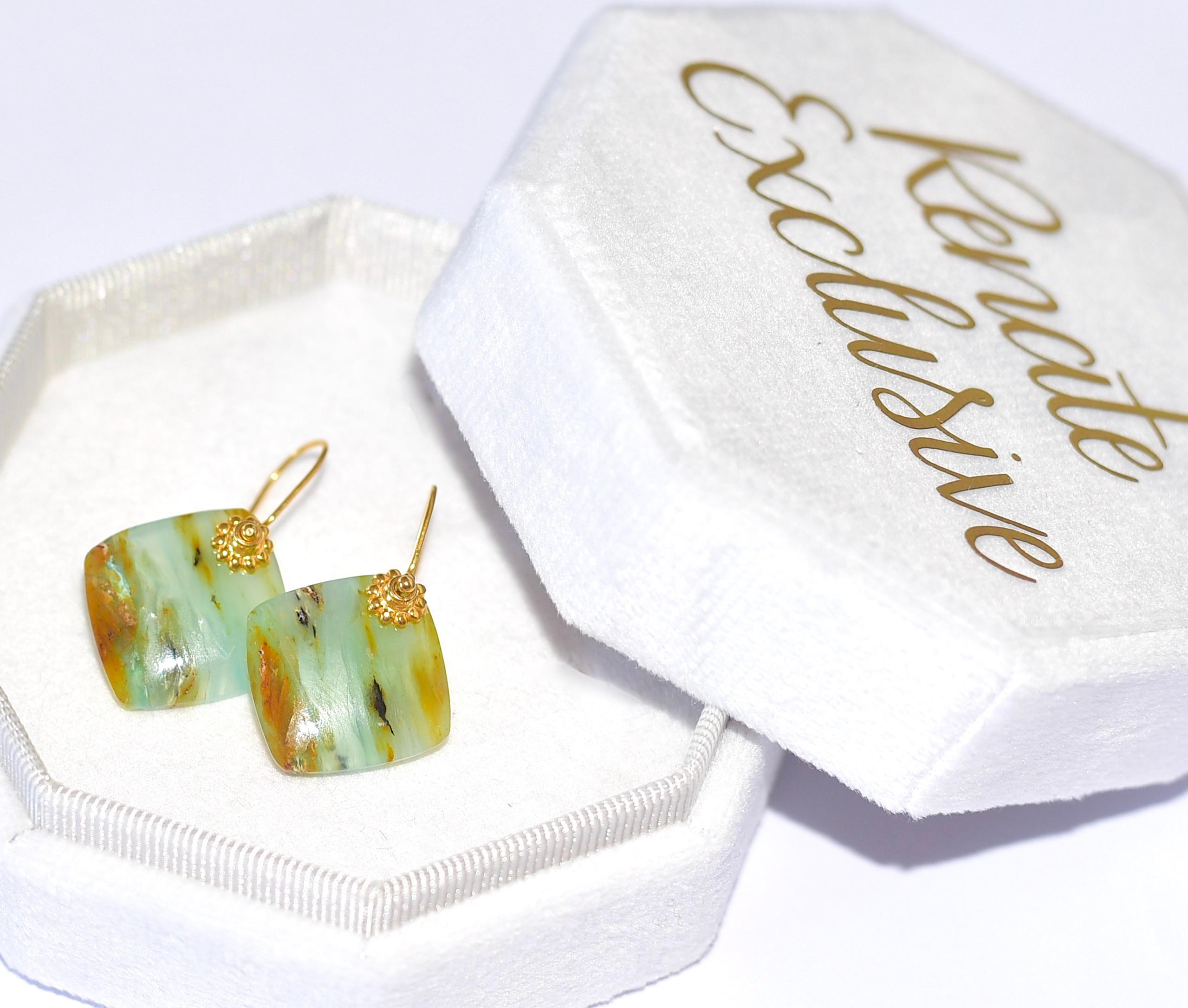 Simple, yet memorable Peruvian Opal ( Stone size: 21mm x 4mm ) earrings. 
Peruvian blue opal is relatively rare and is only found in the Andes mountains near San Patricio, Peru. It is a very translucent stone with a color similar to the Caribbean