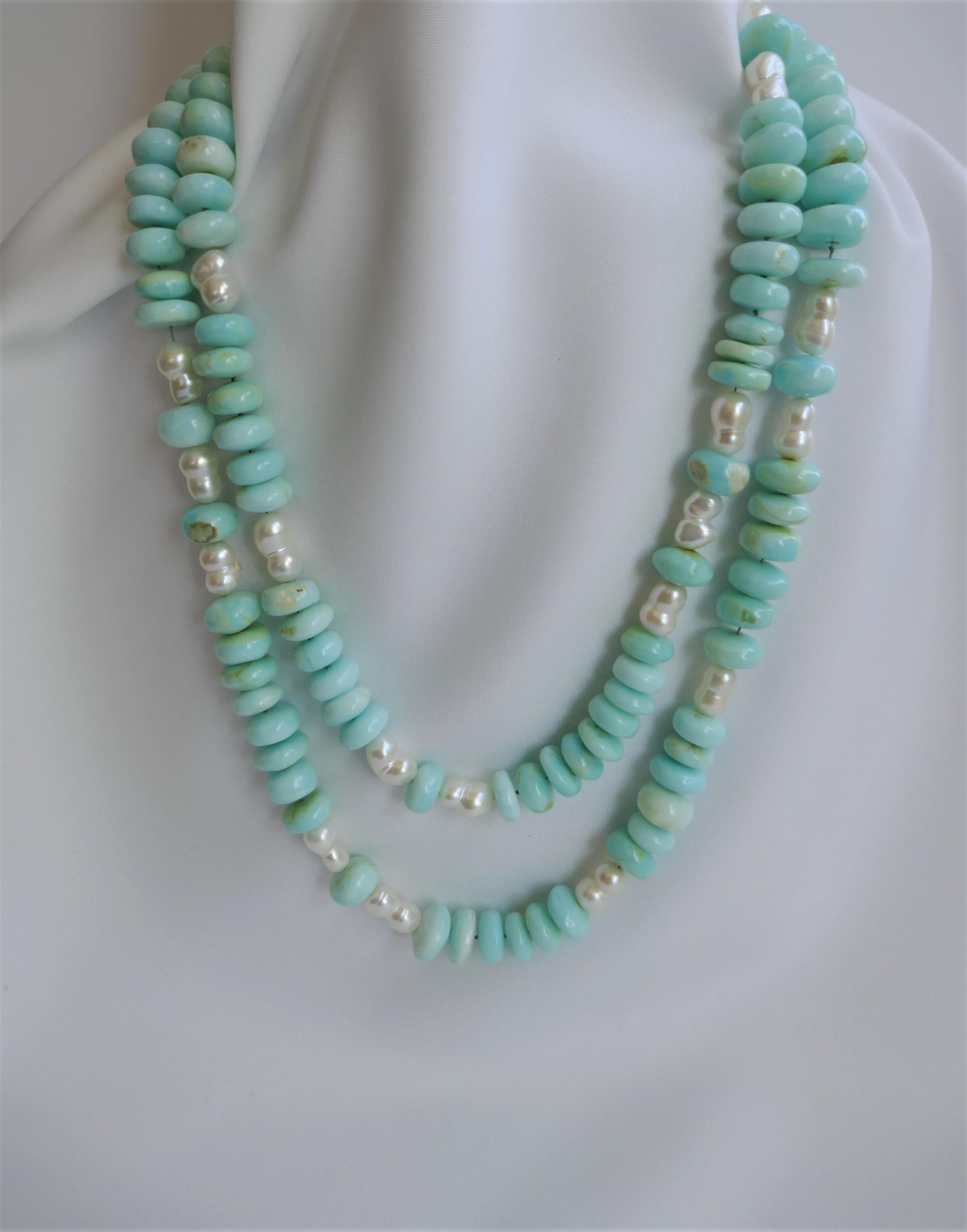 This necklace is very wearable and allows you to wear it in various ways. Because of the clasp it may also be worn as a lariat. The Peruvian opal is 12mm roundels, the pearls are white and it is finished with a sterling silver clasp. This is the