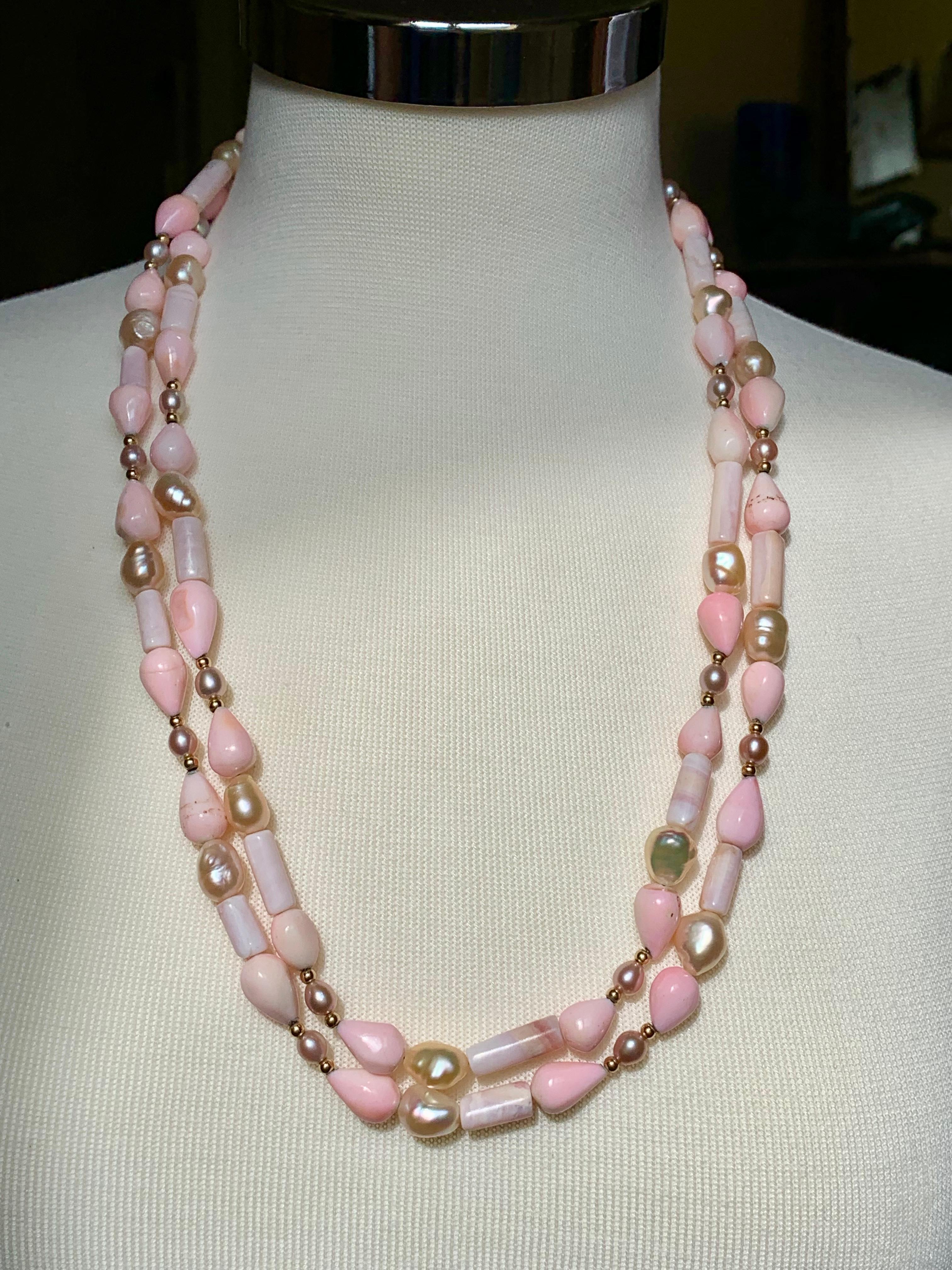 Sabrina Balsky Jewelry
One of a kind  Natural Peruvian Pink Opal Handmade Necklace with Pear shaped and tubular shaped Peruvian Opals with Natural Lustrous Baroque Freshwater Pink Pearls and Seed Pearls bordered with 14K gold beads.  53
