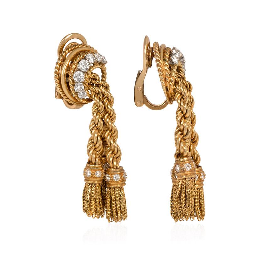 A pair of gold and diamond earrings designed as ropetwist and fringe tassels suspending from circular diamond surmounts, in 18k and platinum.  France, Péry et Cie.  Atw. 1.00 ct. diamonds.

Péry et Cie was a master jewelry workshop that had produced