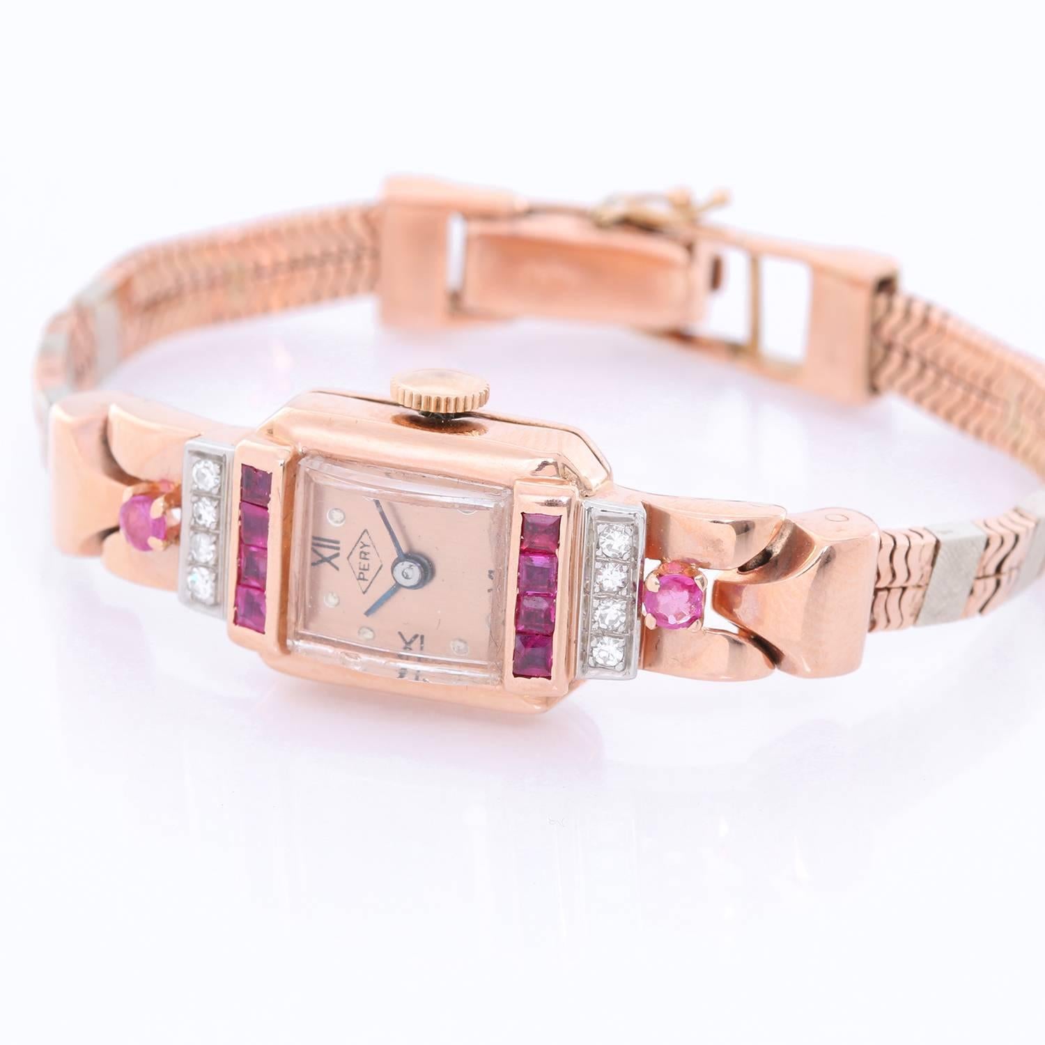 Vintage Ladies Rose Gold (Diamond/Ruby) Pery watch - Manual winding. Rose gold ( 13 x 25 mm ). Rose gold dial with Roman numeral markers. Art deco rose gold bracelet; will fit a 5 3/4 inch wrist . Pre-owned with custom box.