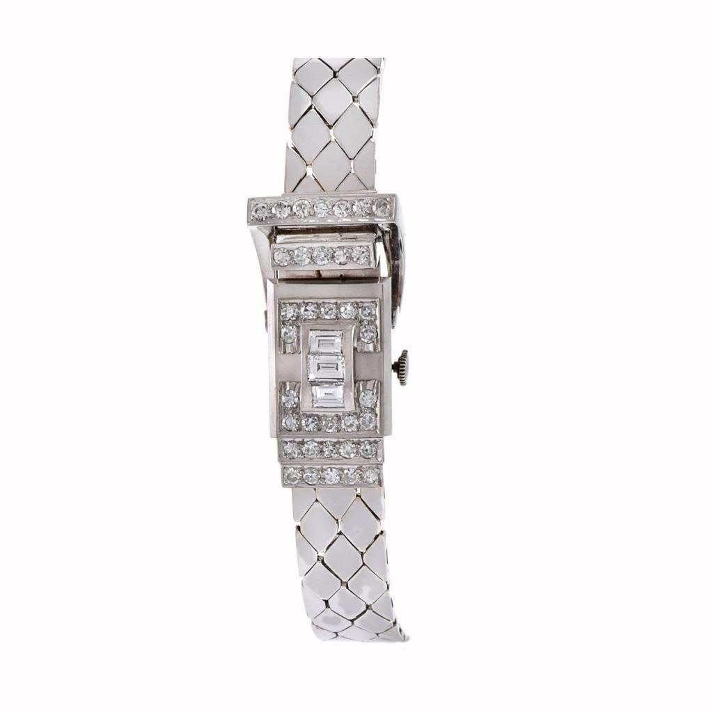 Introducing a masterpiece from Pesag, Vintage Retro Era design, the 14KT White Gold and Diamond Hinge Case Ladies Wrist Watch. This exquisite timepiece, featuring a 17x37mm case, exudes sophistication and glamour with its captivating design.
Encased