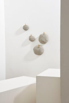 Serie Pescador, scultura da parete in calcestruzzo e ottone con pescatore