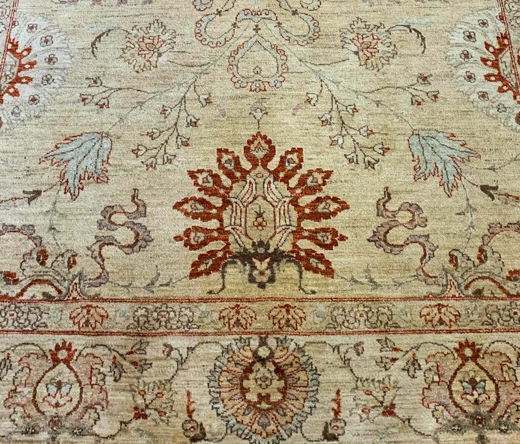 Peshawar Oushak Hand-Knotted Carpet, with floral arabesque motif and elaborate border. 10' 4