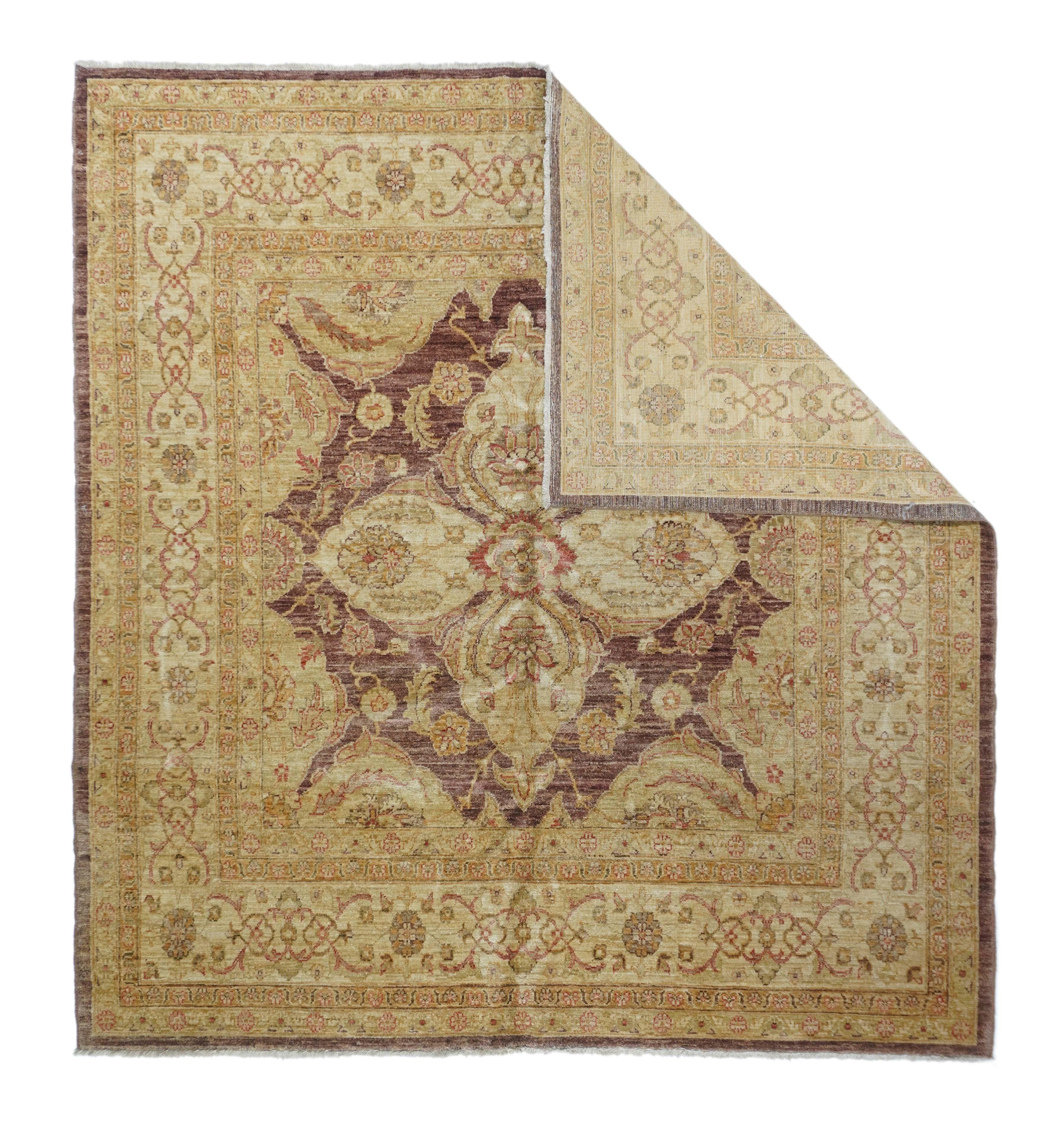 This Pakistan scatter shows a striated abrash red field centred by a large palmette cross, with fractional medallions in the corners. Ecru-beige border with small rosettes and arabesque interlaces. Dark red plain outer frame. Medium weave on cotton.