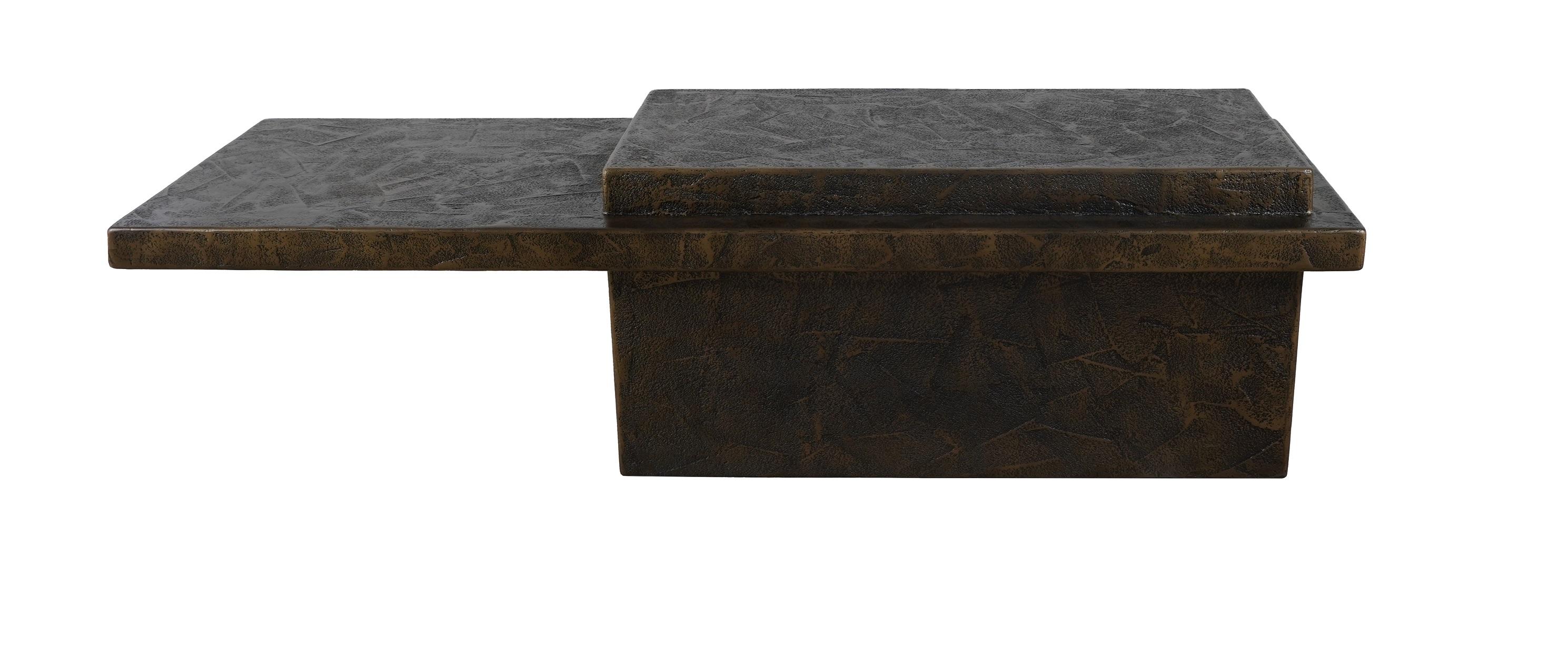 This handcrafted coffee table is crafted from a composite blend of wood, resin, and fiberglass, it features a distinctive design inspired by the raw and unadorned aesthetics of the brutalist school of design. Drawing inspiration from the robust