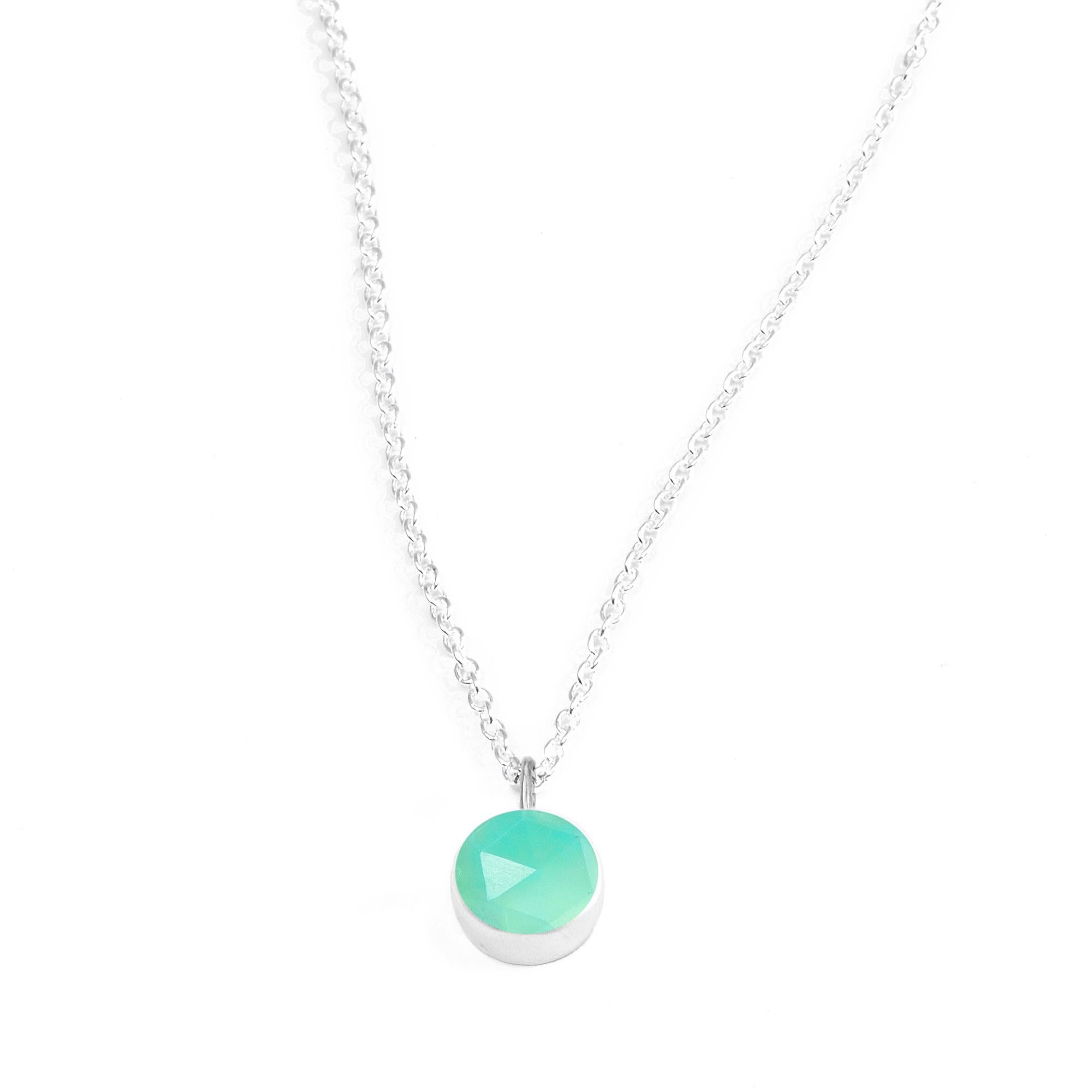 Made with chrysoprase rimmed in a textured silver bezel, our Petal Silver Necklace is a natural complement to your personal style

Stone carat: 3.5
Length: 16-18''
Stone size: 10mm

About The Stones:
Genuine Chrysoprase
A distinctive and very rare