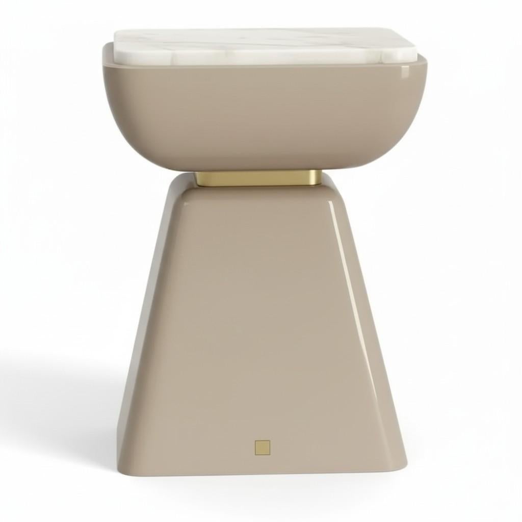 Combining elegant design with luxurious materials, this side table is a sophisticated addition to any interior. The body of the table features a  glossy Greige lacquer finish with a modern, extra-matte touch that feels both soft and refined. Its