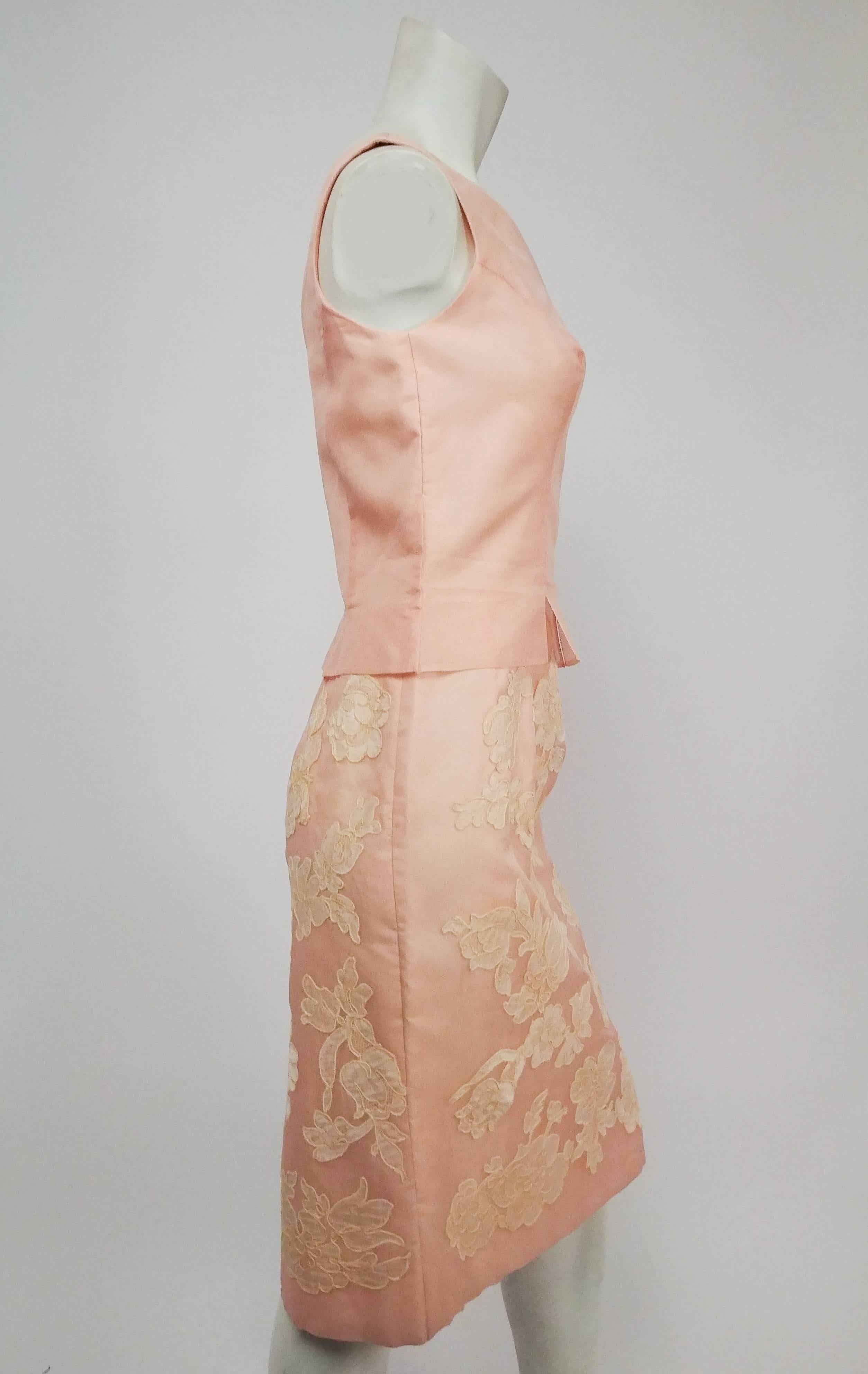 Petal Pink Organza Cocktail Dress w/ Lace Appliqué, 1960s. Romantic pink silk organza sheath dress with wide boat-neck collar and flattering princess seams at bodice. Skirt is embellished with white lace appliqué and ends at knee. Zips up side. 
