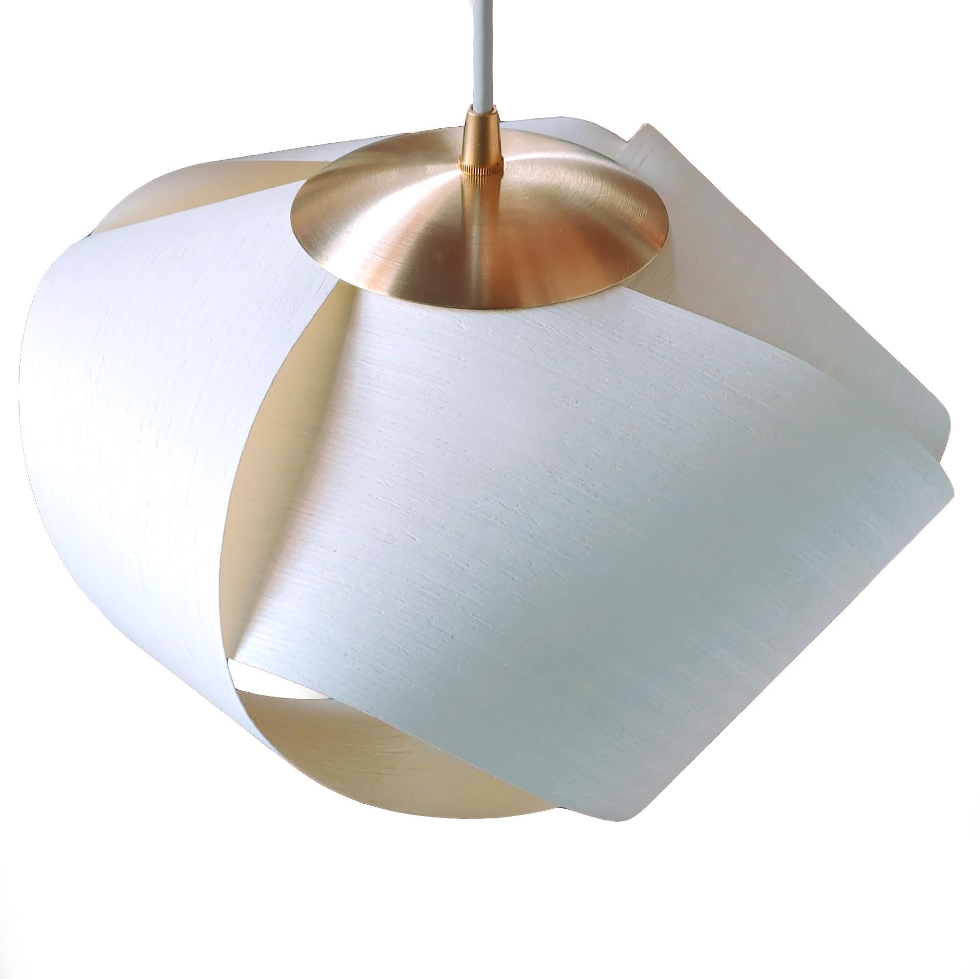 PETAL, featuring brushed brass hardware, is a contemporary Mid-Century Modern light fixture. An Organic-Modern piece with wood veneer and a brushed brass accent. This is a minimalist luxury pendant design which can be exhibited in dining rooms,
