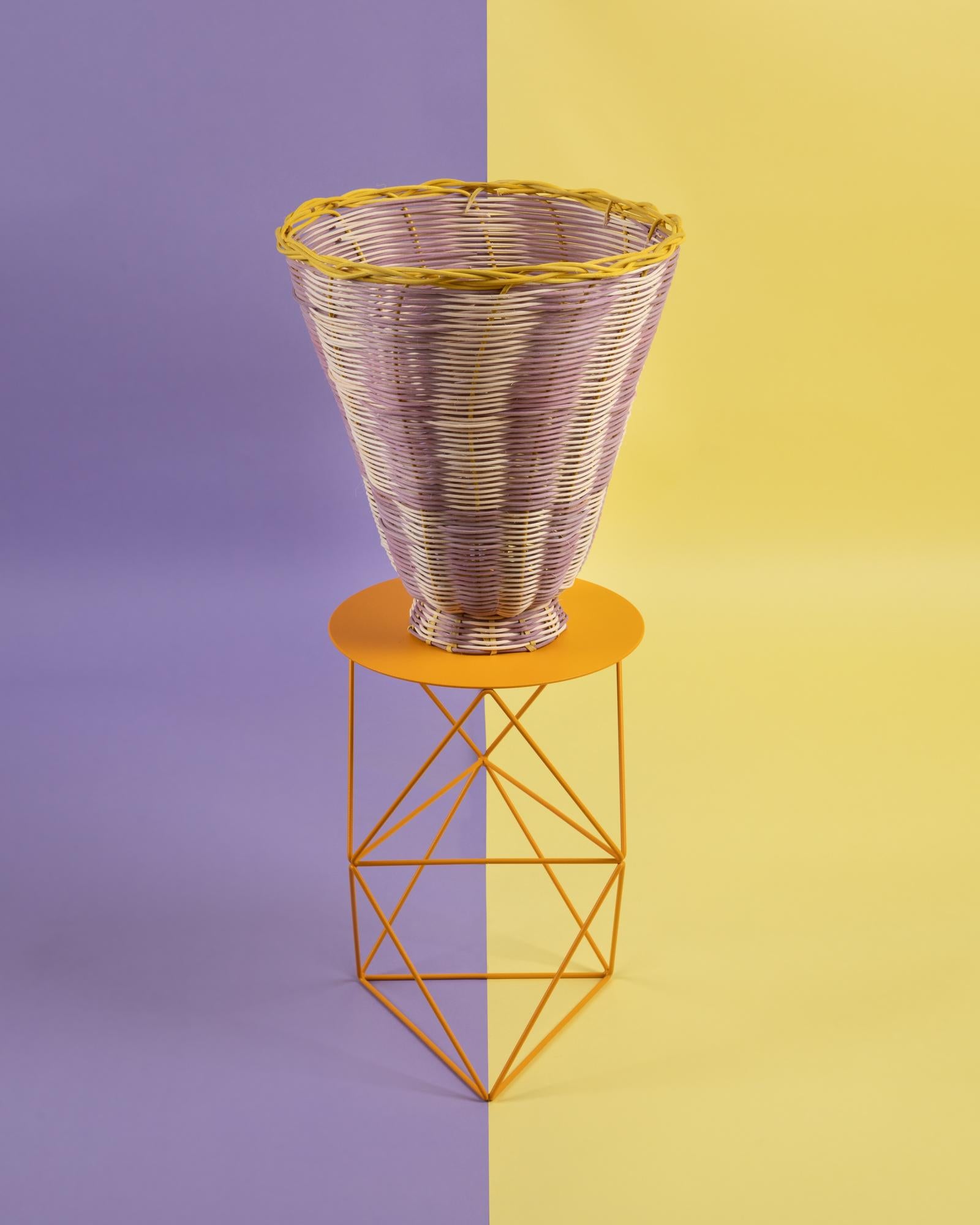 The Petal woven vase is hand dyed and woven with reed in our Chicago studio. Inspired by forms in ancient Greek ceramics, the material language of this vessel brings together the rich craft history of weaving with 3 dimensional form.

All of Studio