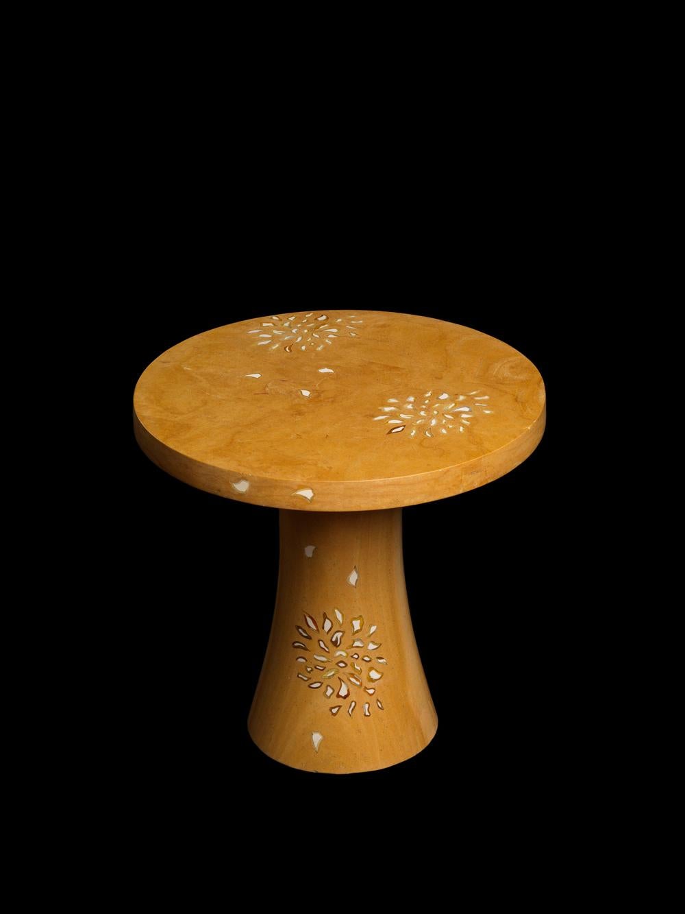 The petals table is a part of the Ornamenti collection. Delicately cut pieces of agate, tiger eyes, mother of pearl and other semi precious stones are carefully inlaid into the base stone by our master craftsmen. The collection features modern